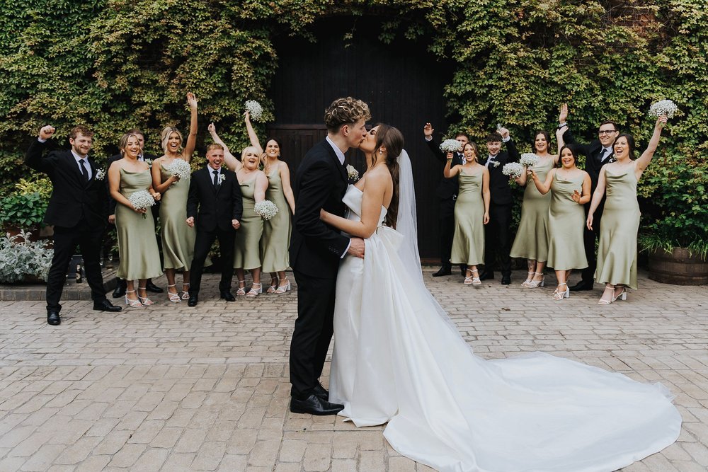 05_Bride and Groom in the farmhouse Courtyard.jpg