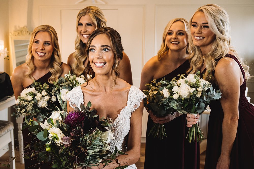 11_Bride and bridesmaids are wedding-ready at The Normans wedding venue. Photo by Lumiere Photographic.jpg