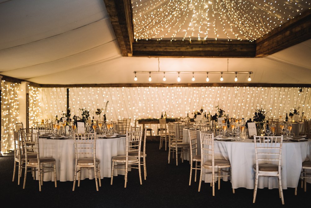 32_Circular tables set for dinner in The Normans wedding venue Grain Shed. Photo by Lumiere Photographic.jpg