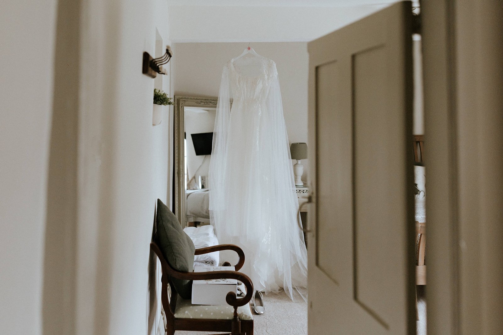 02_The wedding dress in The Normans wedding venue Cottage. Image by Monkeymole.jpg