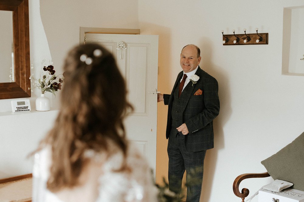 05_Bride and father of the bride in The Normans wedding venue Cottage. Photo by Monkeymole (2).jpg