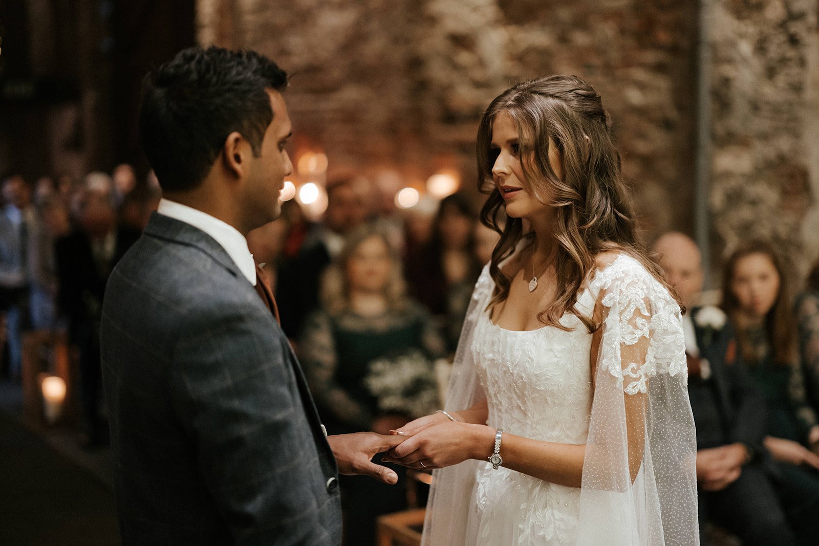 06c_Bride and groom exchange marriage vows in The Normans wedding venue Ceremony Barn. Photo by Monkeymole (4).jpg