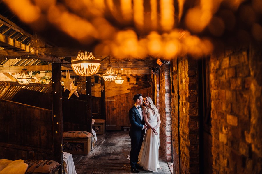 07b_Bride and groom in Normans Cow Stalls. Photo by Joel Skingle.jpg