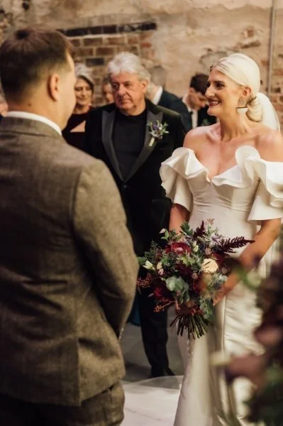 02_Bride and groom exchange vows in The Normans Ceremony Barn. Photo by Bloom.jpg