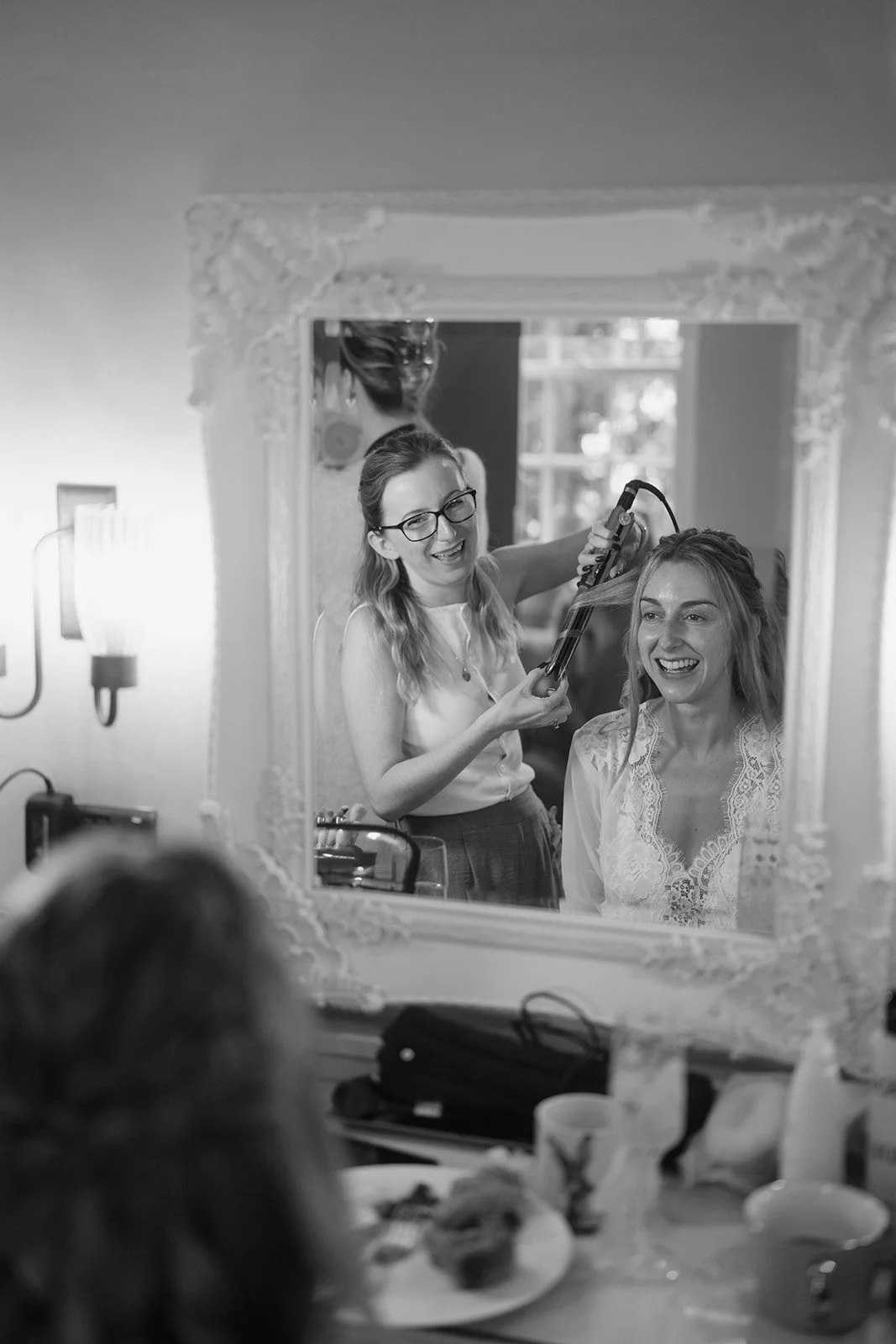 bride-laughing-mirror-bridal-prep.jpg