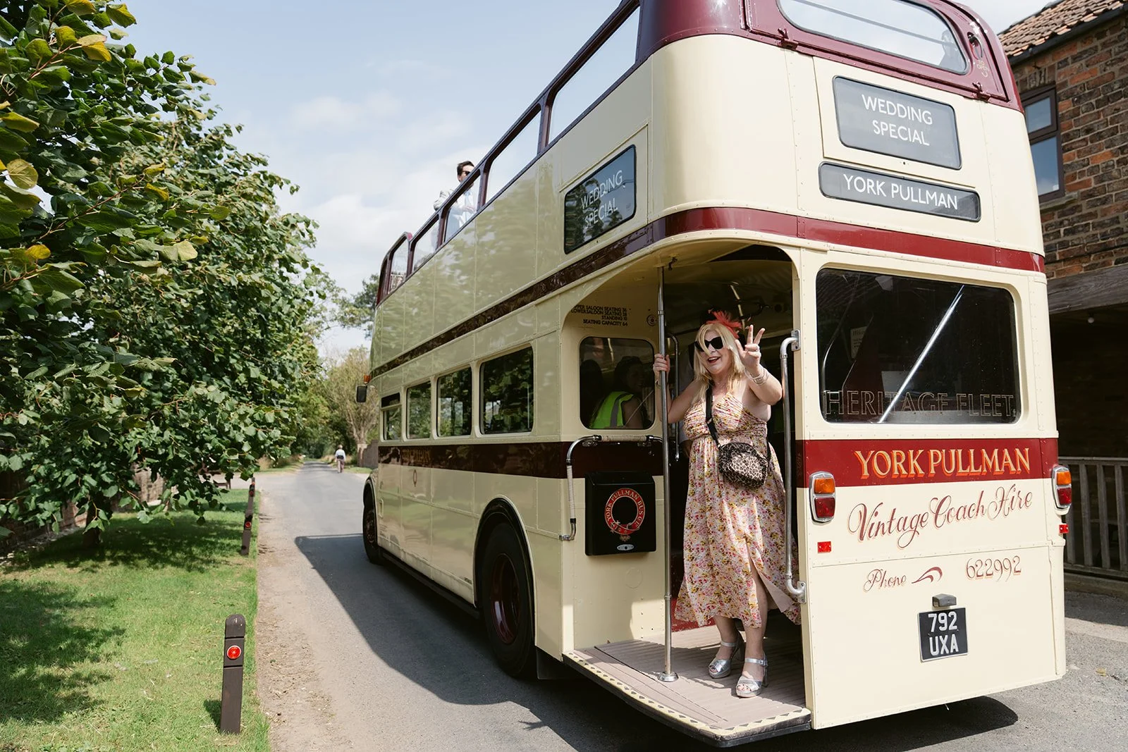 wedding-guest-waving-vintage-york-pullman-bus.jpg