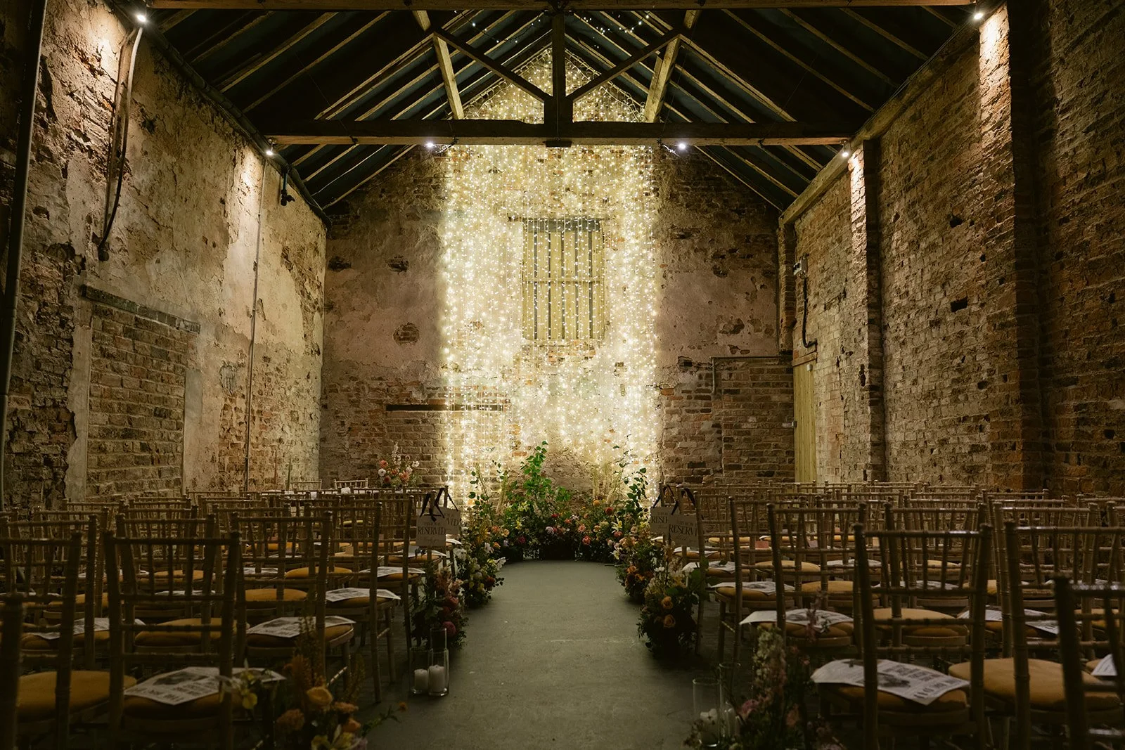 rustic-barn-wedding-ceremony-fairy-light-backdrop.jpg