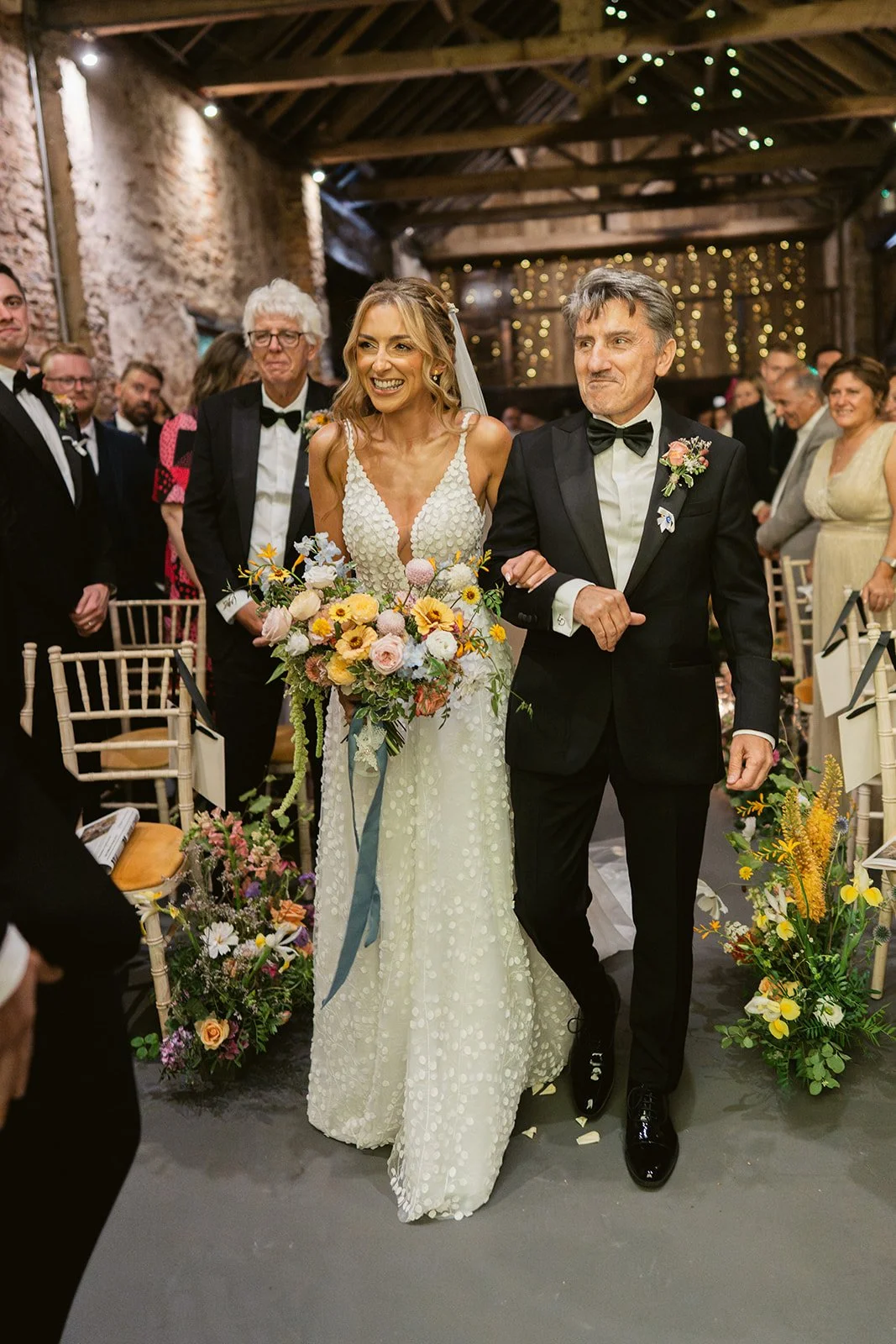 bride-father-walking-down-aisle-barn-ceremony.jpg