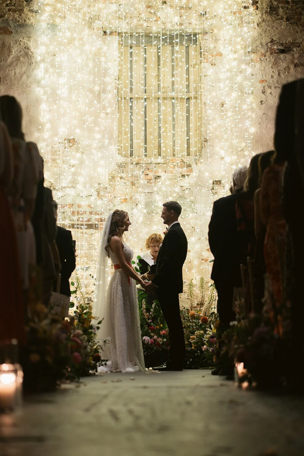 bride-groom-vows-fairy-light-curtain-ceremony.jpg