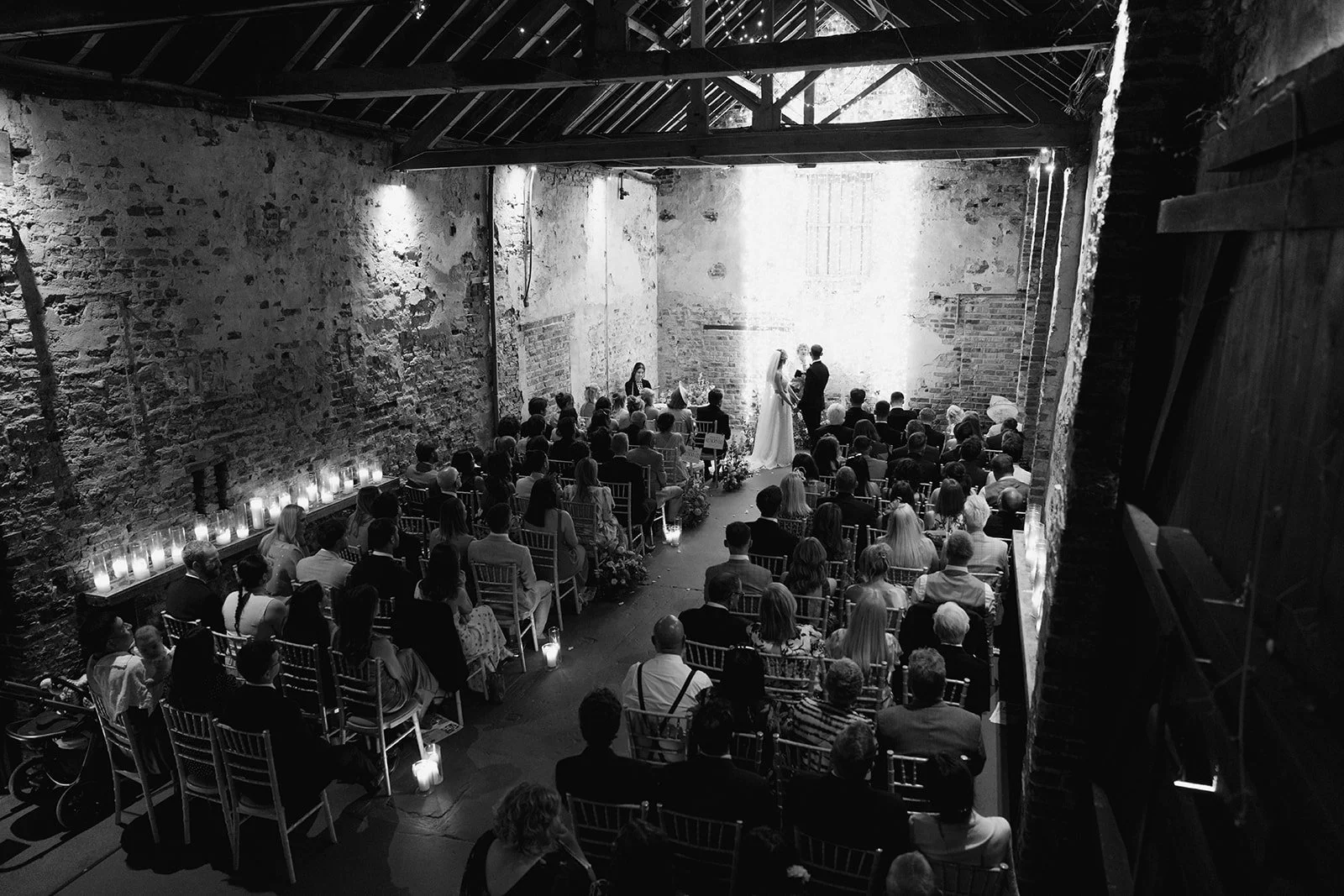 wedding-ceremony-old-barn-candlelit-aisle-view.jpg