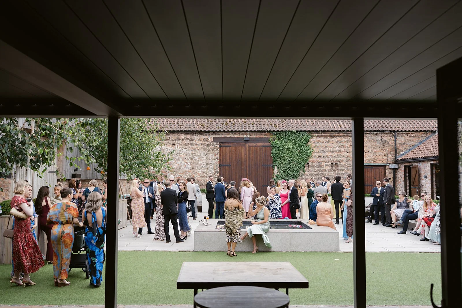 drinks-reception-courtyard-water-feature-the-normans.jpg