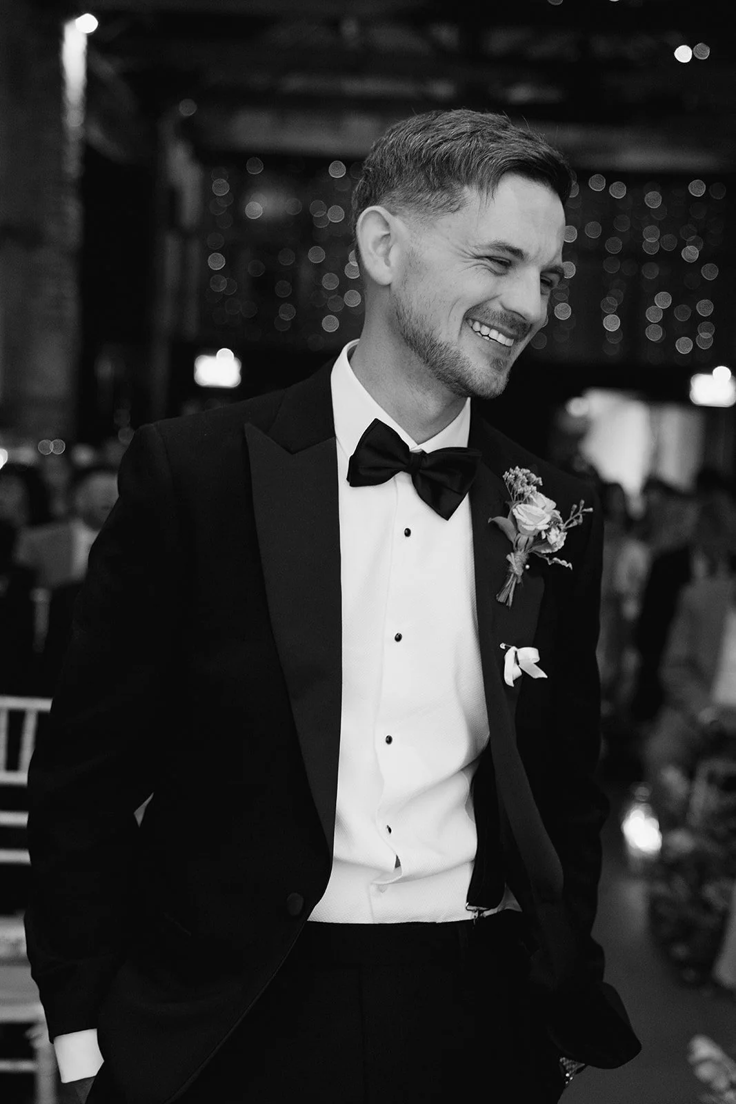 groom-laughing-ceremony-barn-black-tie.jpg