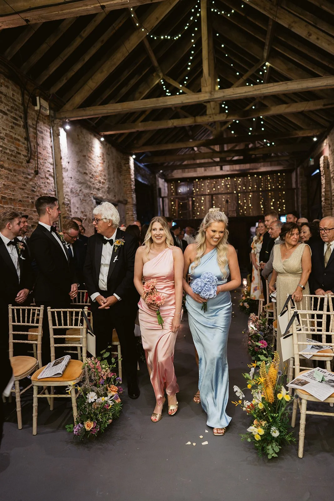 bridesmaid-copper-satin-dress-candlelit-aisle.jpg