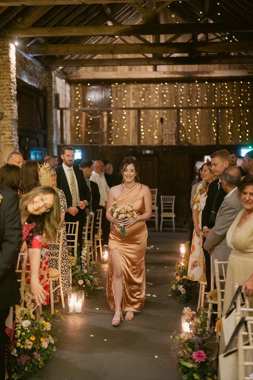 bridesmaids-pink-blue-satin-dresses-aisle-procession.jpg