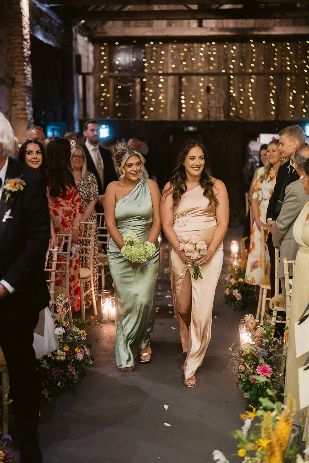 bridesmaids-sage-champagne-satin-barn-aisle.jpg