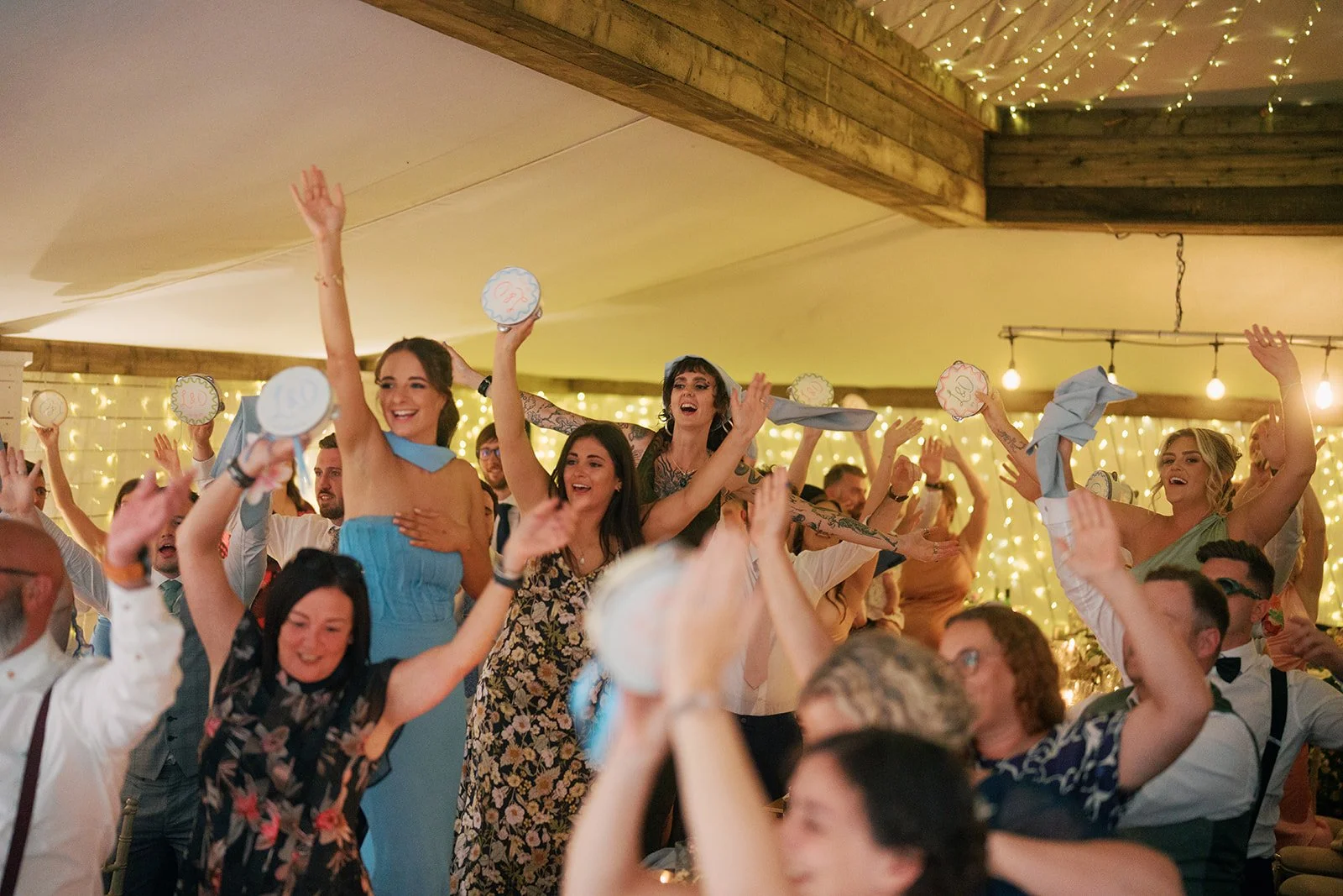 guests-dancing-tambourines-wedding-party.jpg