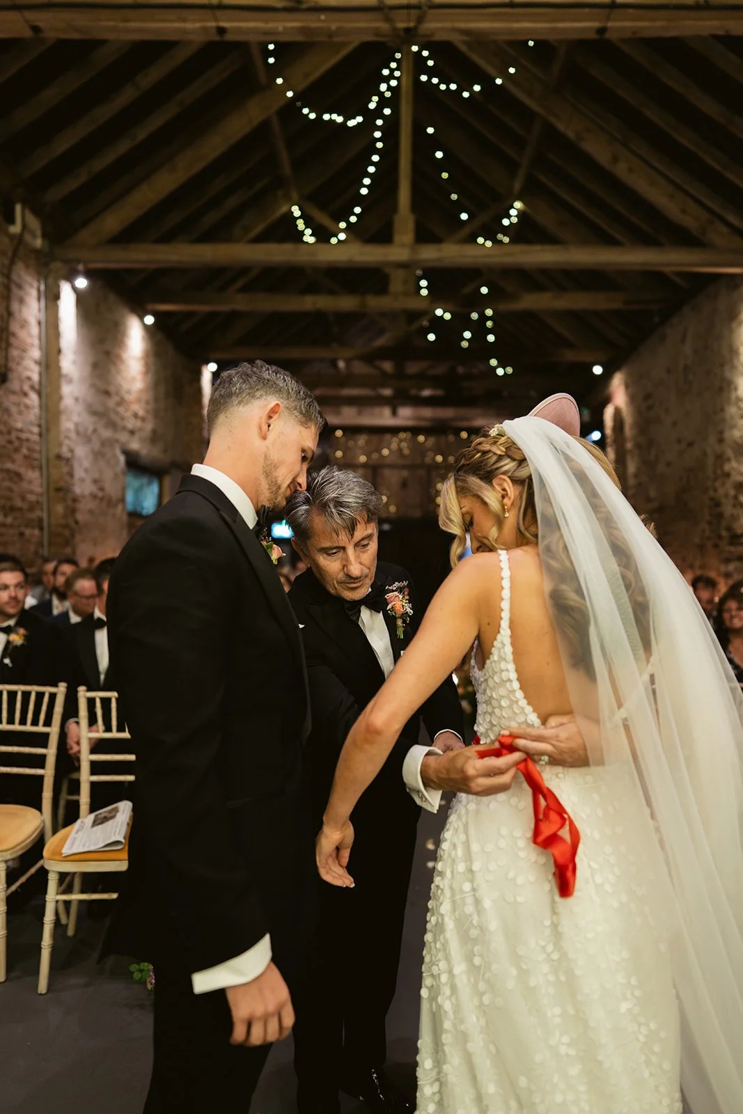 father-tying-red-ribbon-kirmizi-kusak-bride.jpg