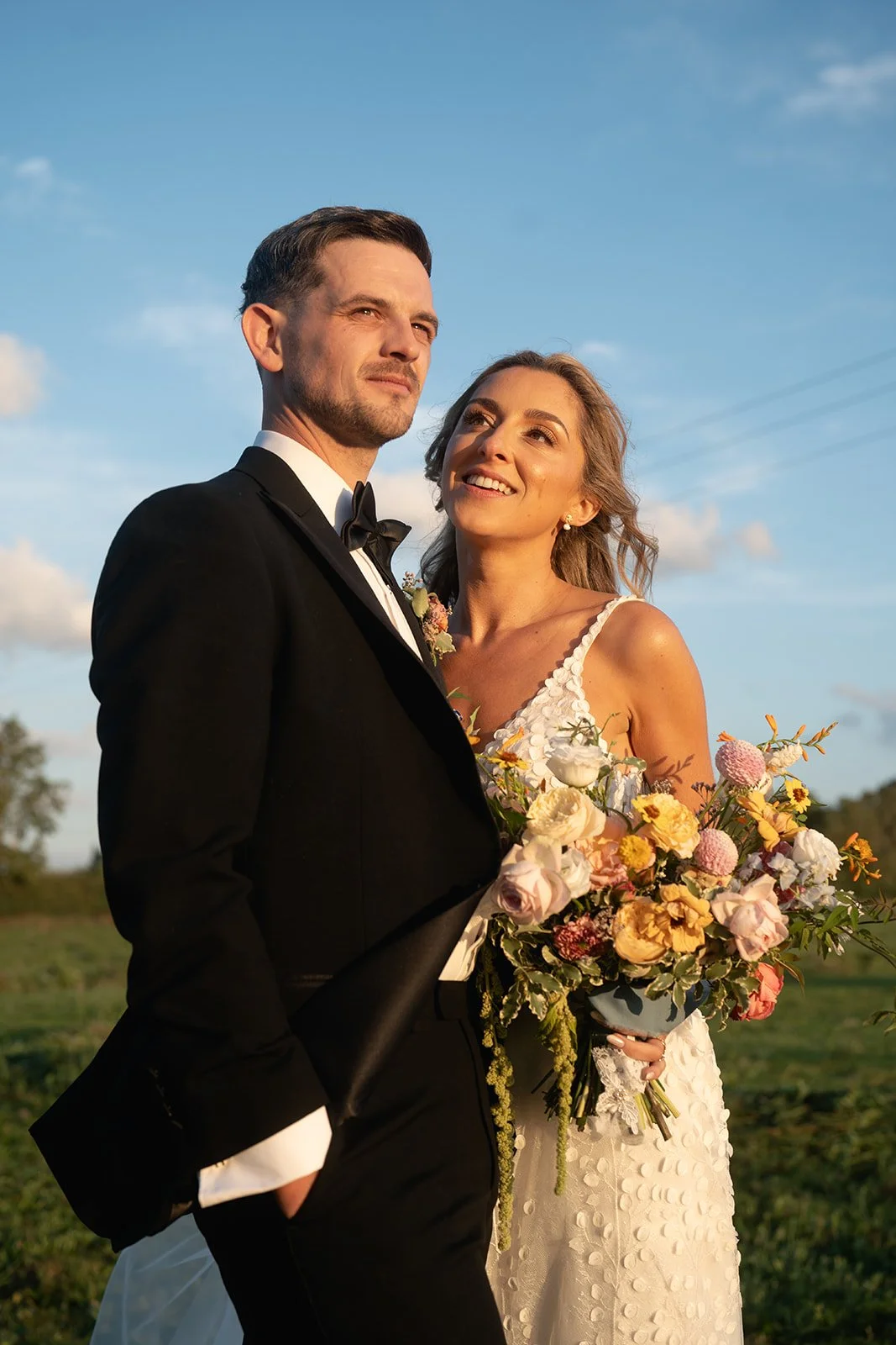 newlyweds-golden-hour-portrait-blue-sky.jpg