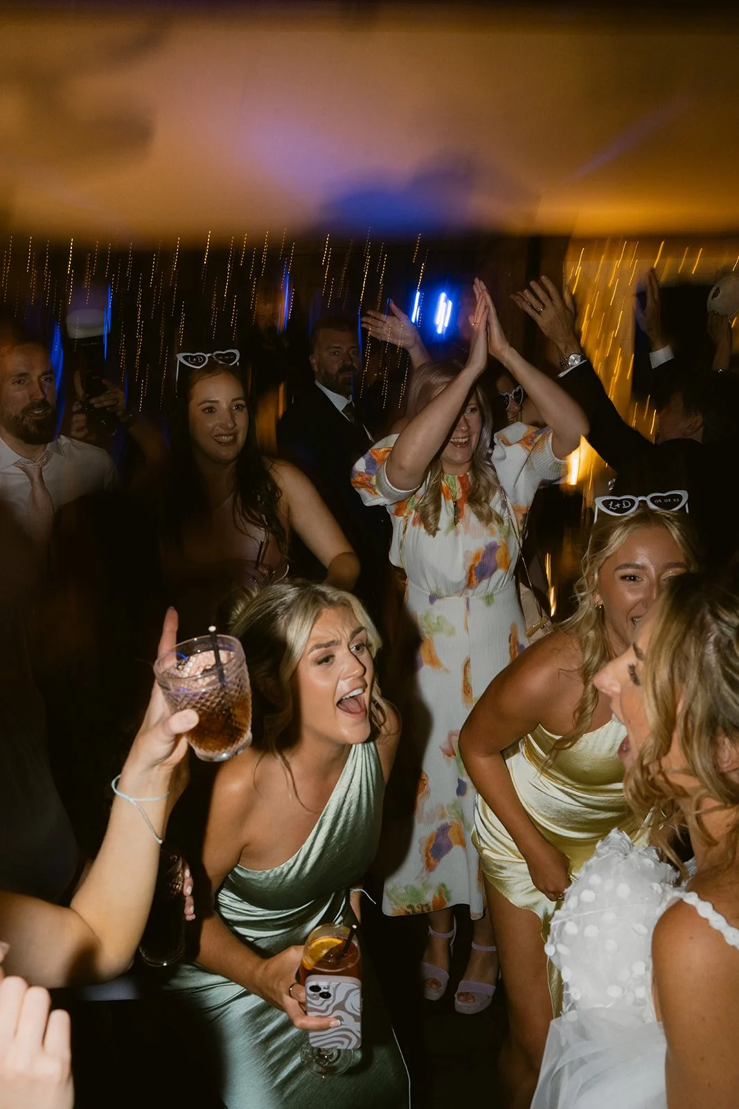 wedding-guests-party-dance-floor-heart-sunglasses.jpg