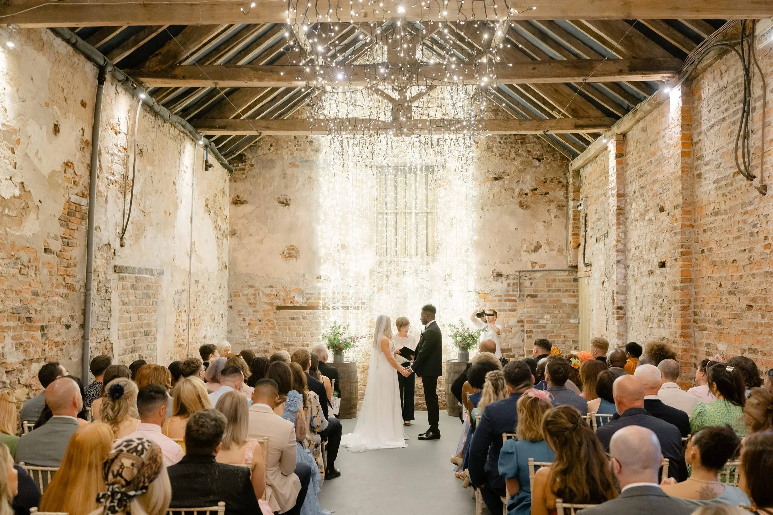 the-normans-barn-wedding-ceremony-guests-seated-334.jpg