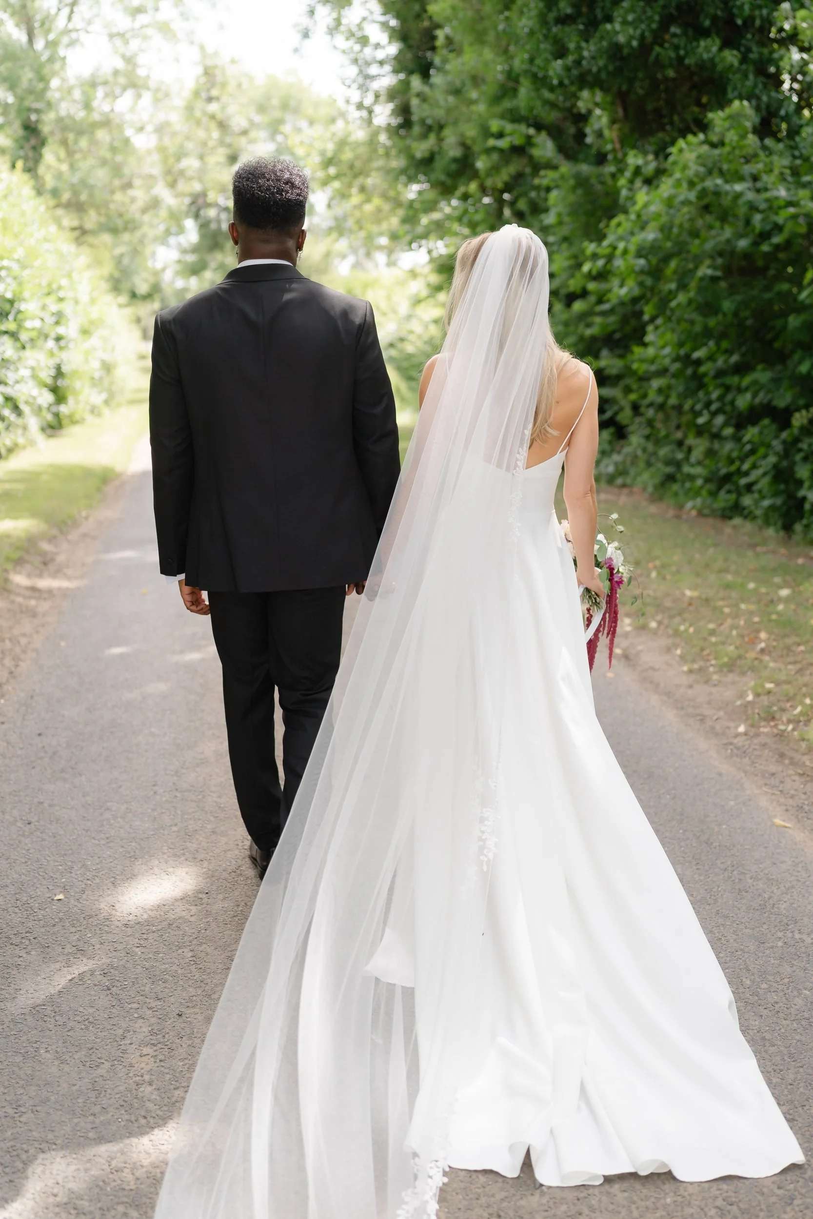 the-normans-couple-walking-country-lane-cathedral-veil-yorkshire-531.jpg