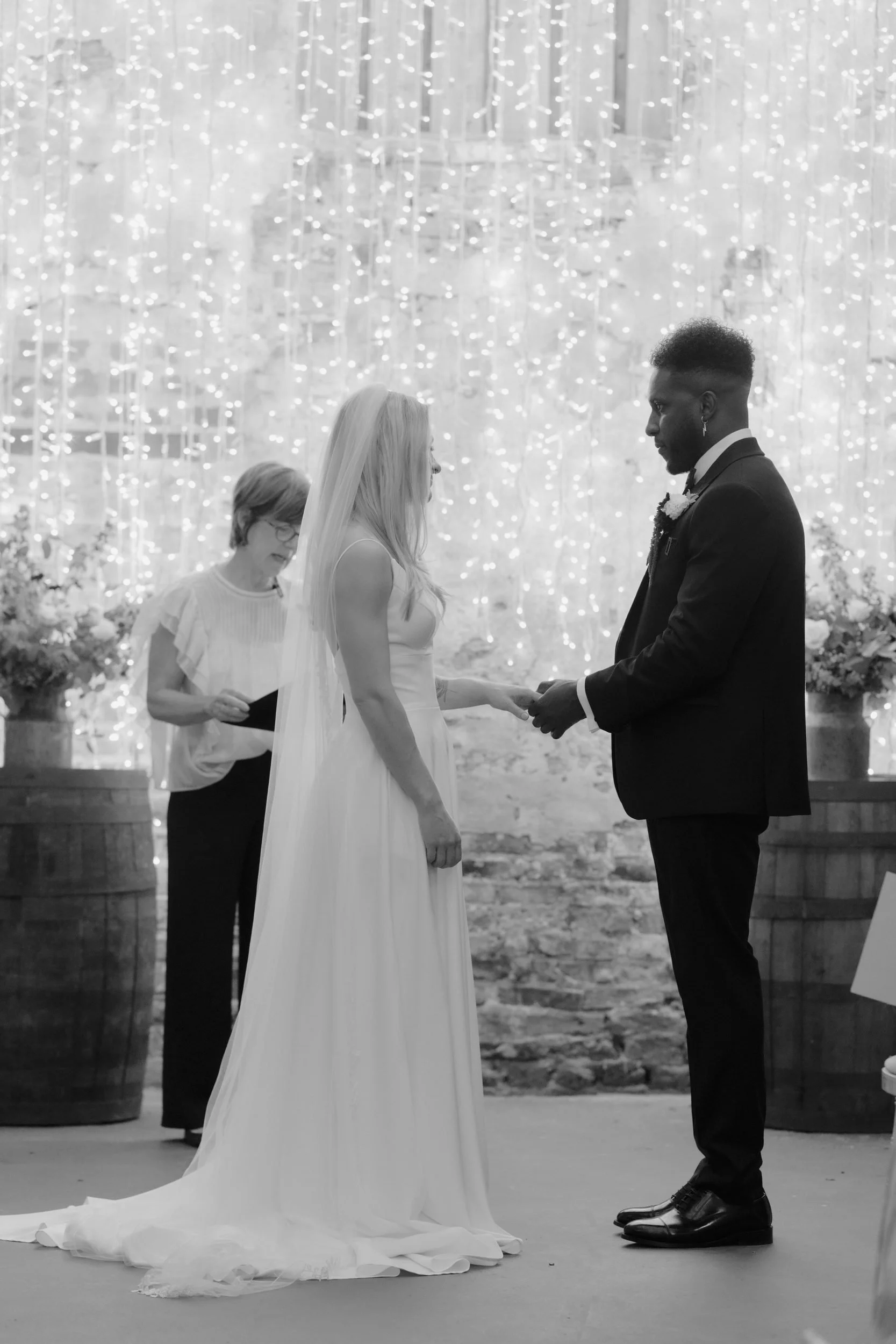 the-normans-exchanging-rings-fairy-lights-black-and-white-357.jpg