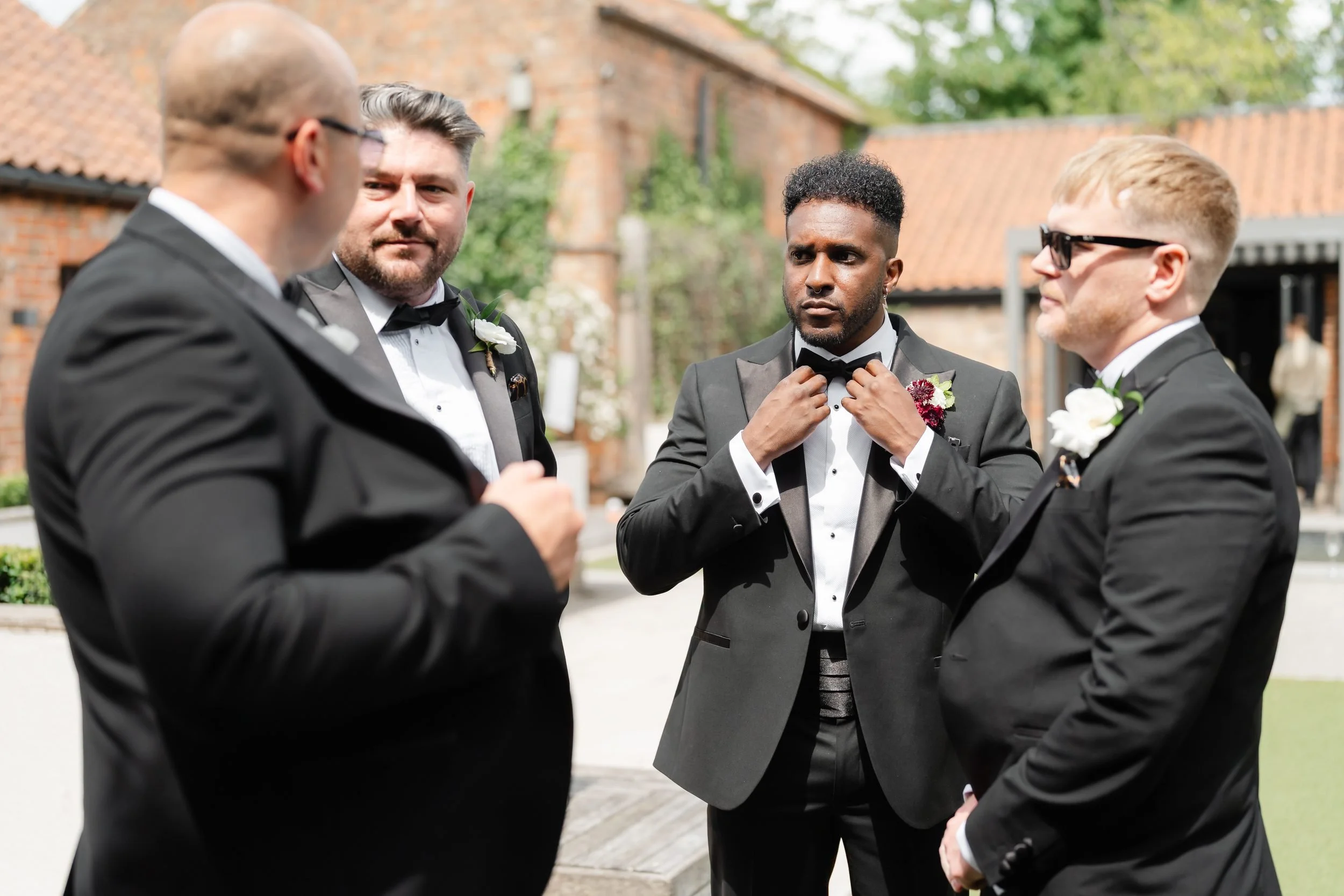 the-normans-groom-groomsmen-black-tie-courtyard-buttonholes-257.jpg
