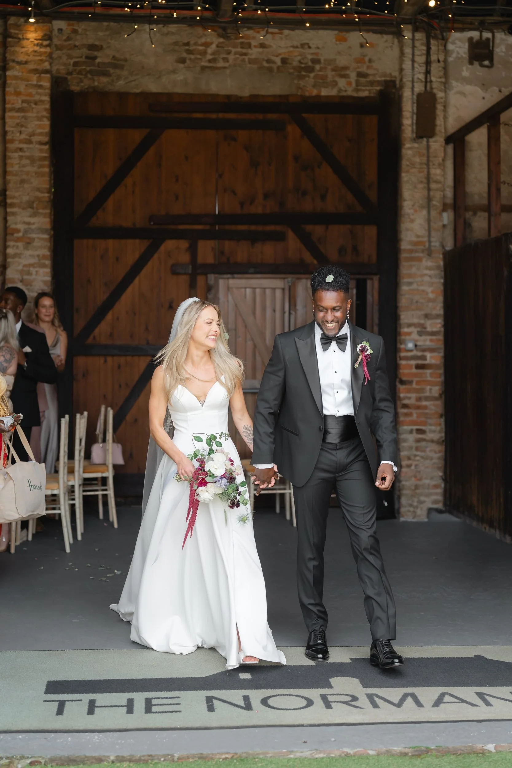 the-normans-newlyweds-barn-doors-logo-carpet-395.jpg