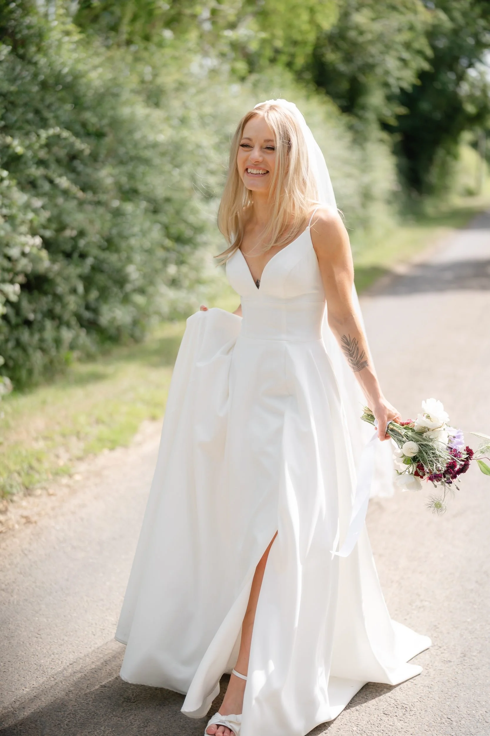 the-normans-bride-walking-country-lane-bouquet-summer-618.jpg