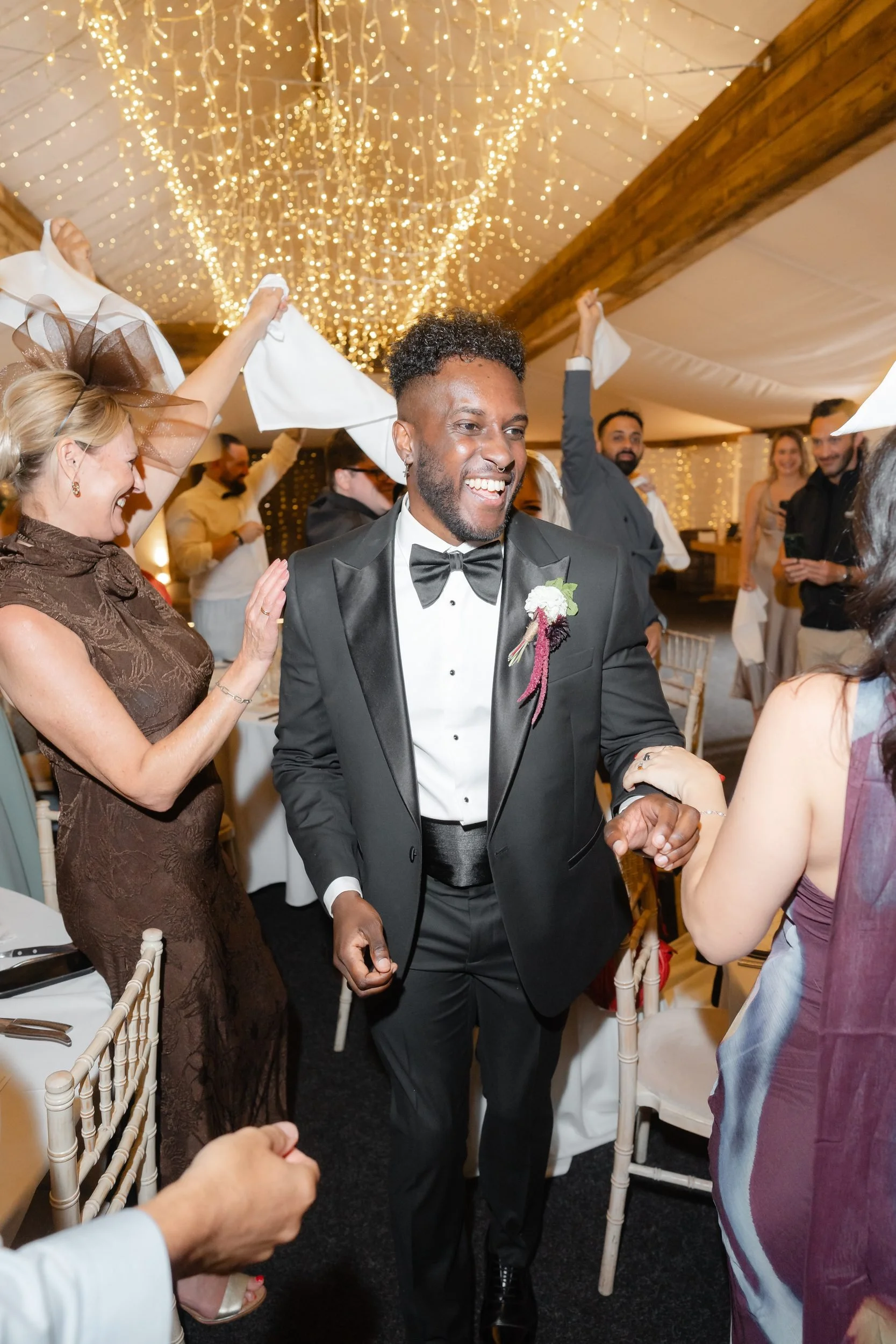the-normans-groom-dancing-napkin-wave-reception-entrance-743.jpg