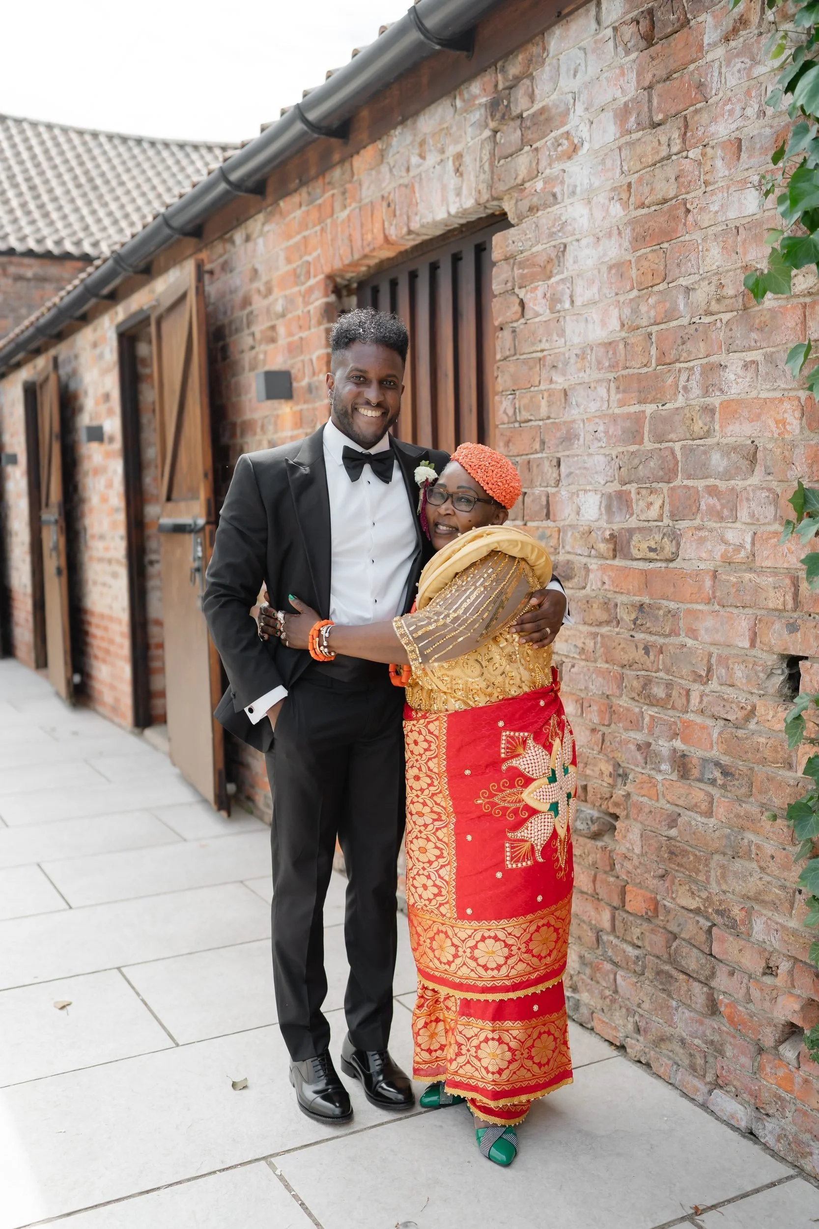 the-normans-groom-with-mother-traditional-dress-brick-barn-660.jpg