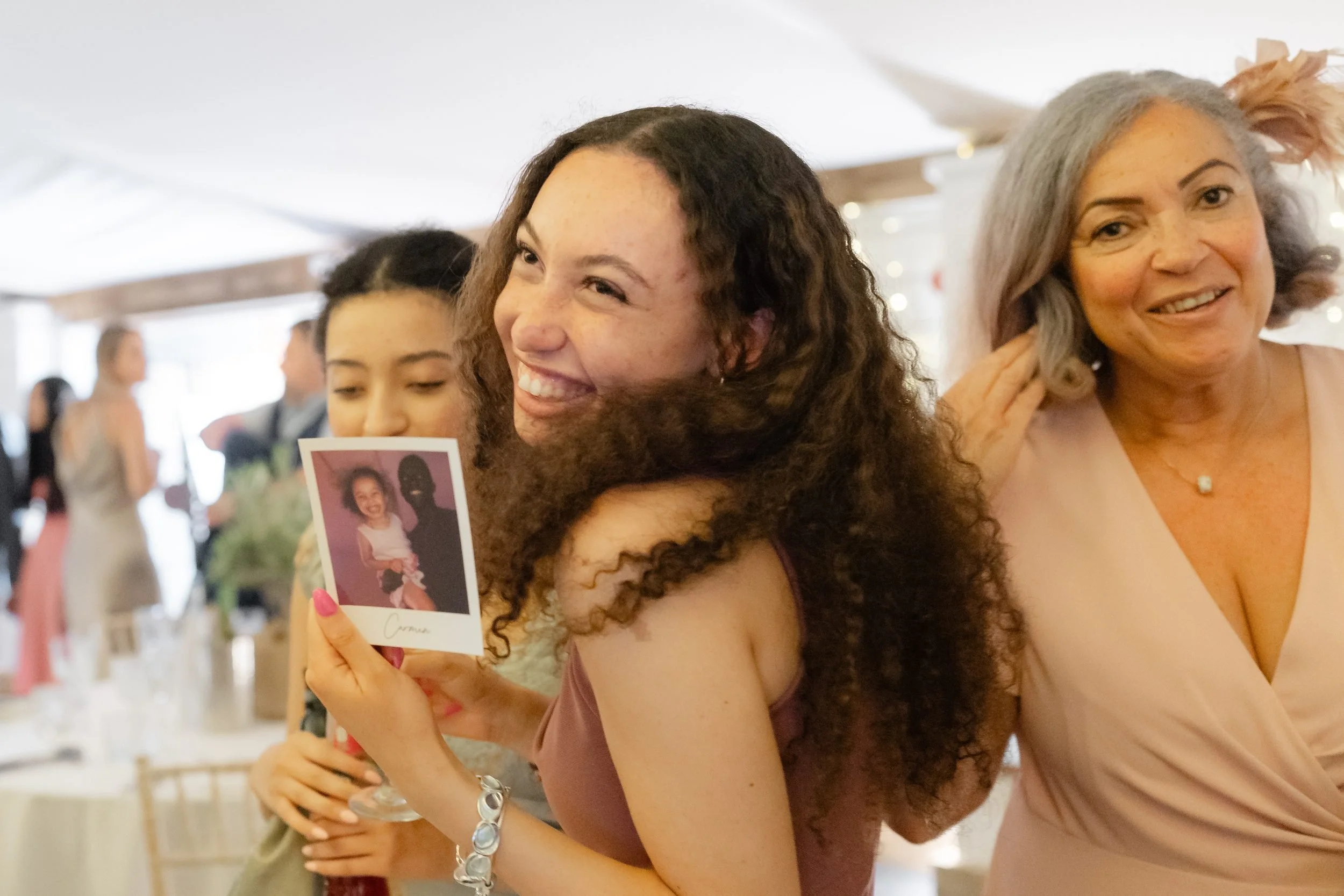 the-normans-guests-laughing-polaroids-wedding-reception-720.jpg
