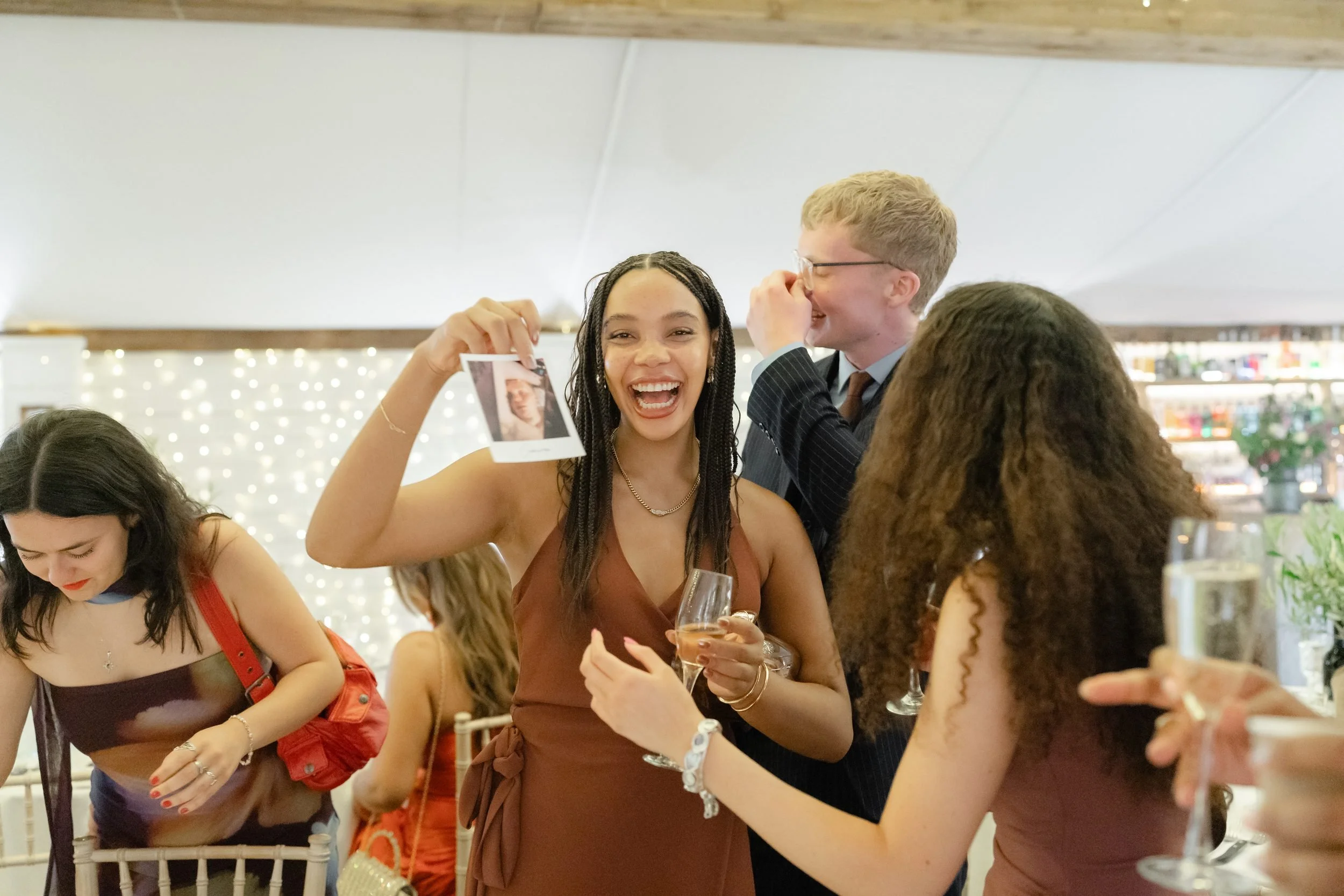 the-normans-guests-polaroid-photos-reception-fairy-lights-713.jpg