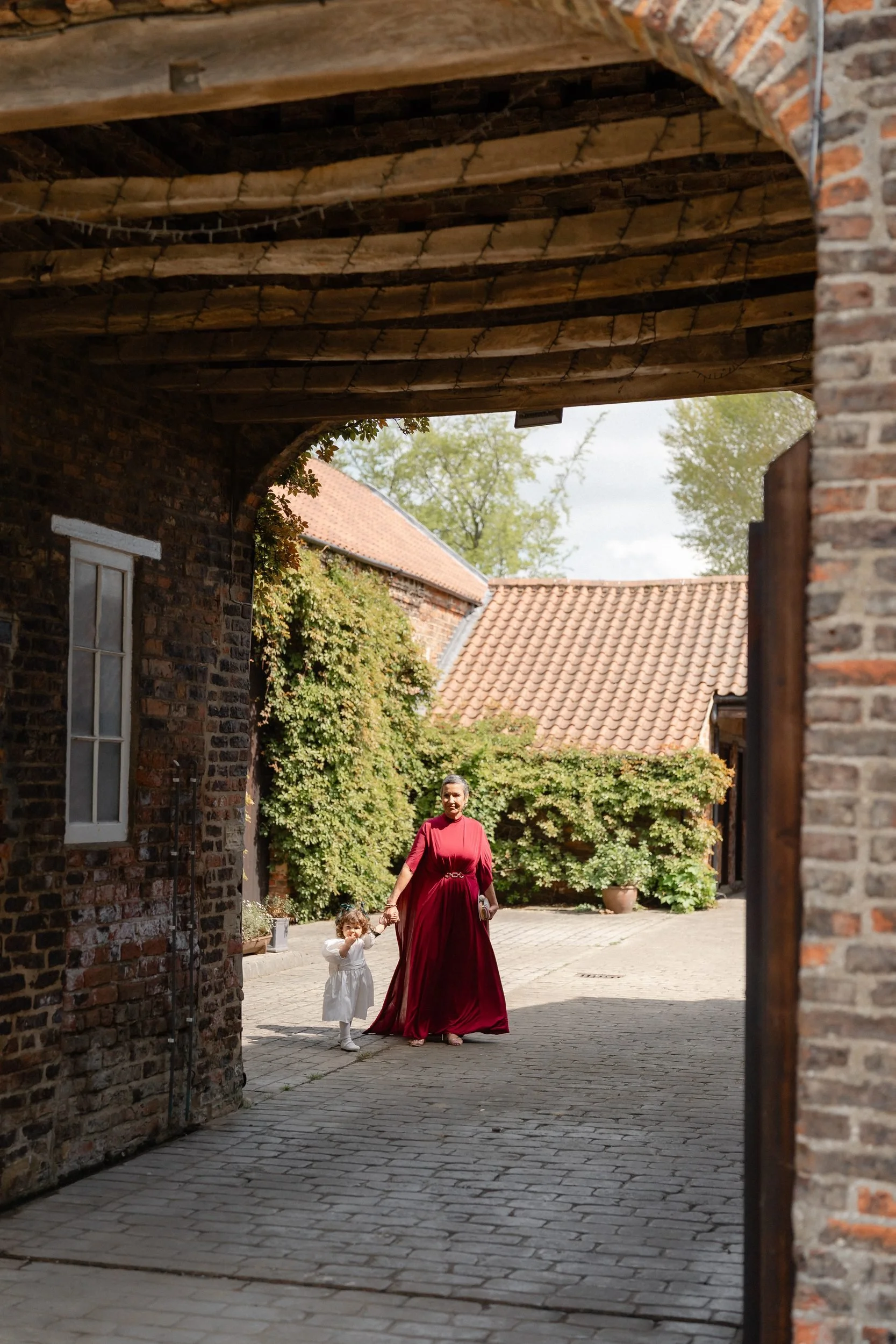 brick-courtyard-arch-mother-of-bride-flower-girl-224.jpg