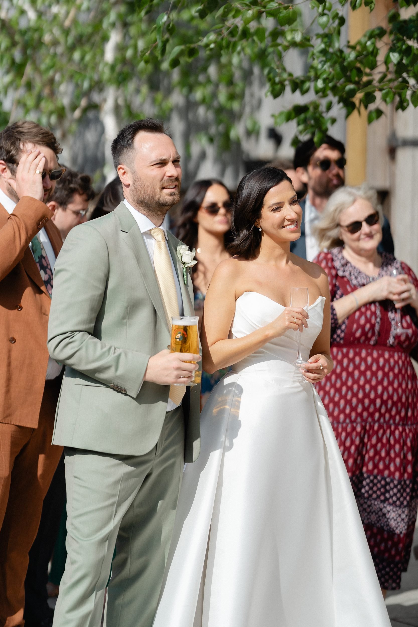 bride-and-groom-listening-to-speeches-courtyard-705.jpg