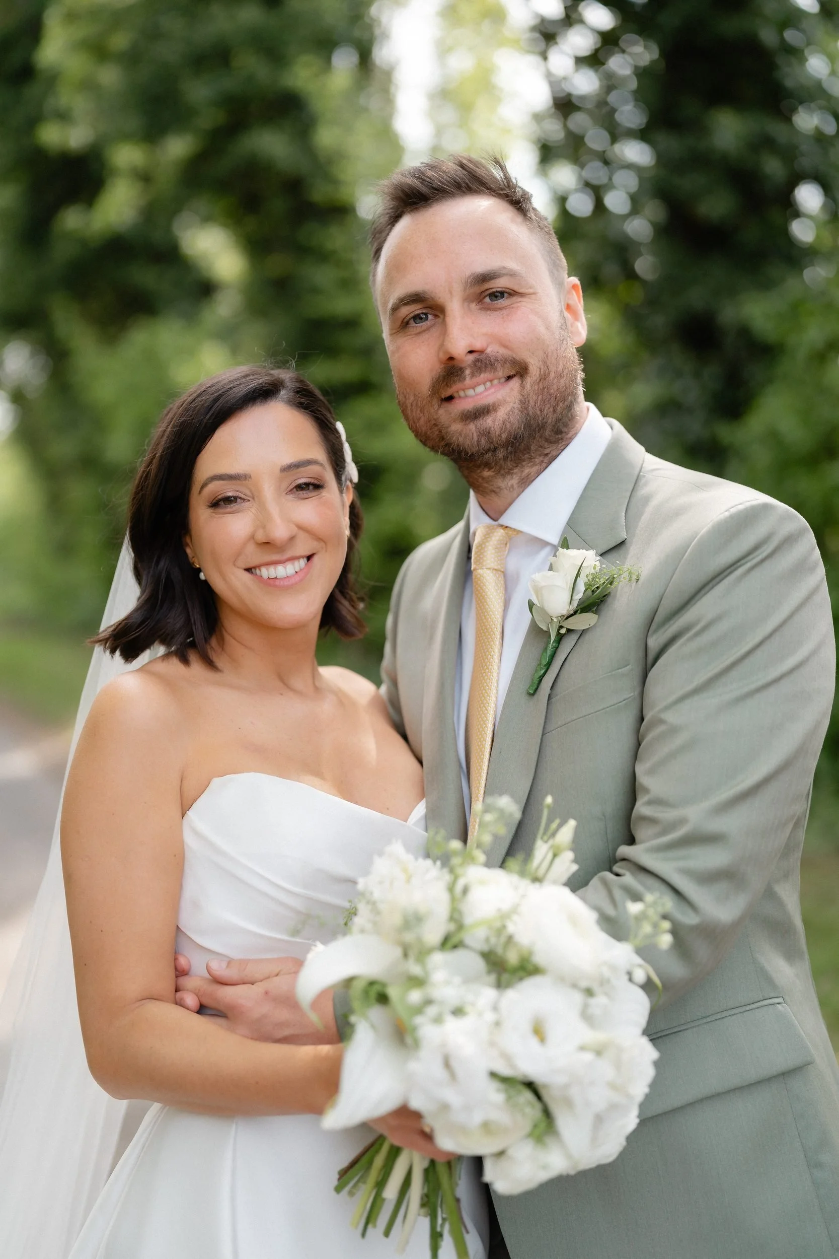 bride-and-groom-portrait-white-bouquet-sage-suit-543.jpg