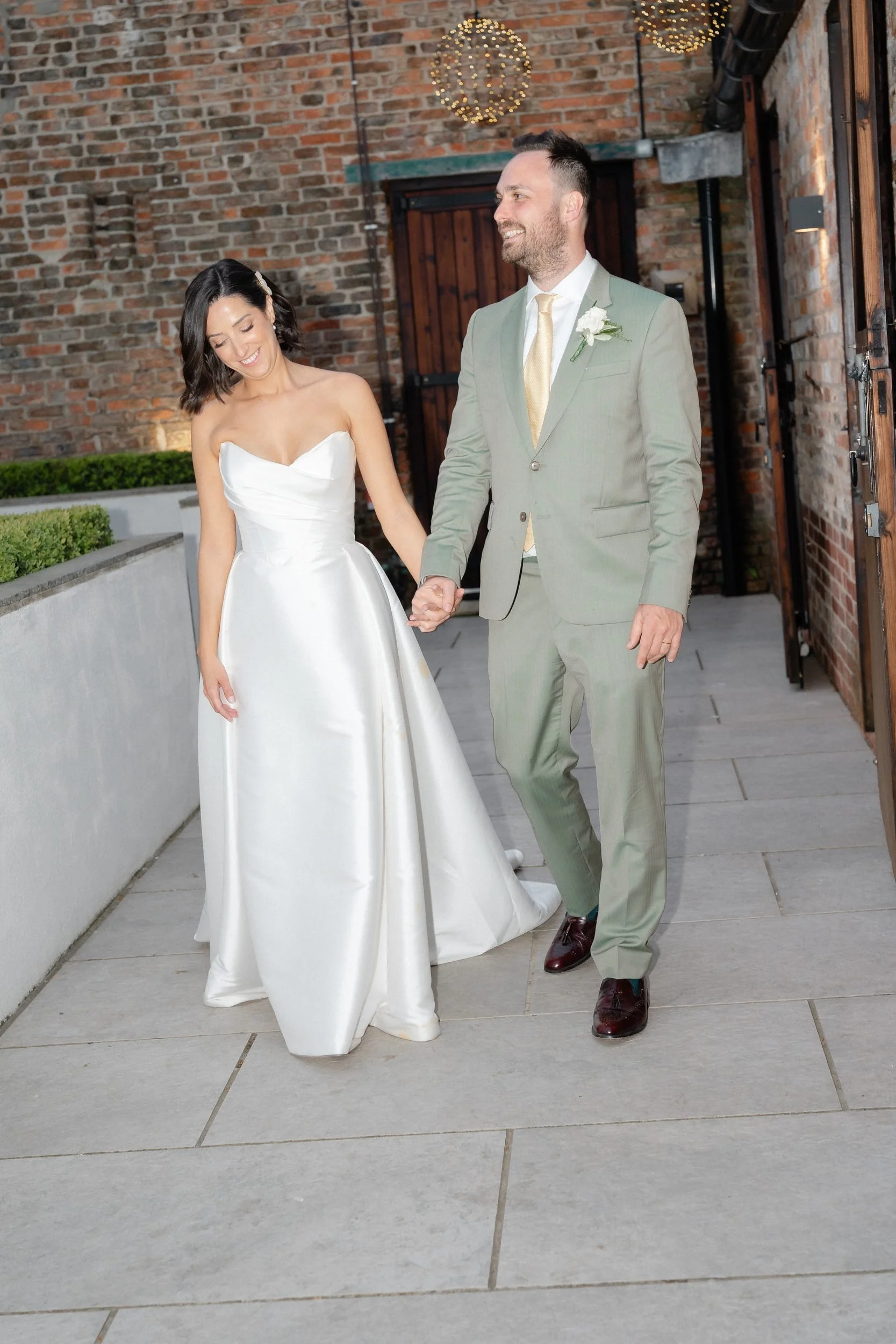 bride-and-groom-walking-into-evening-reception-841.jpg