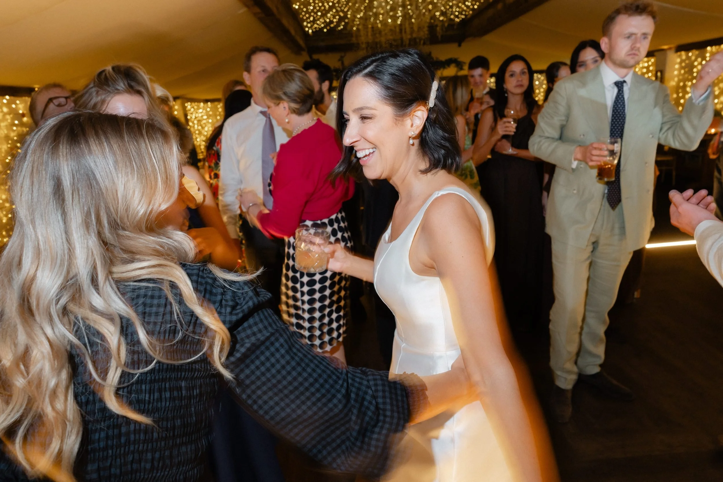 bride-dancing-friends-fairy-lit-marquee-910.jpg