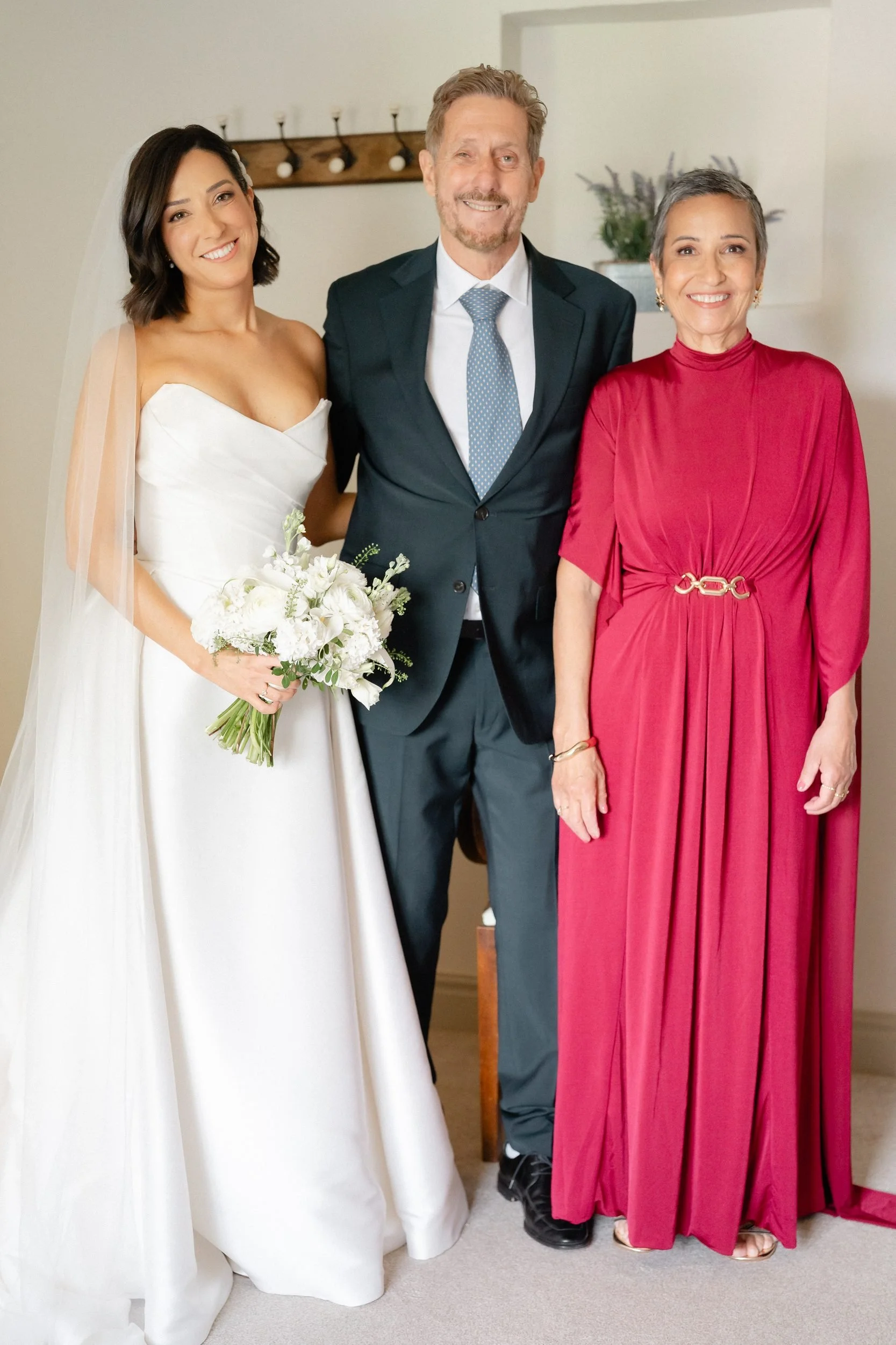 bride-with-parents-before-ceremony-bridal-suite-163.jpg