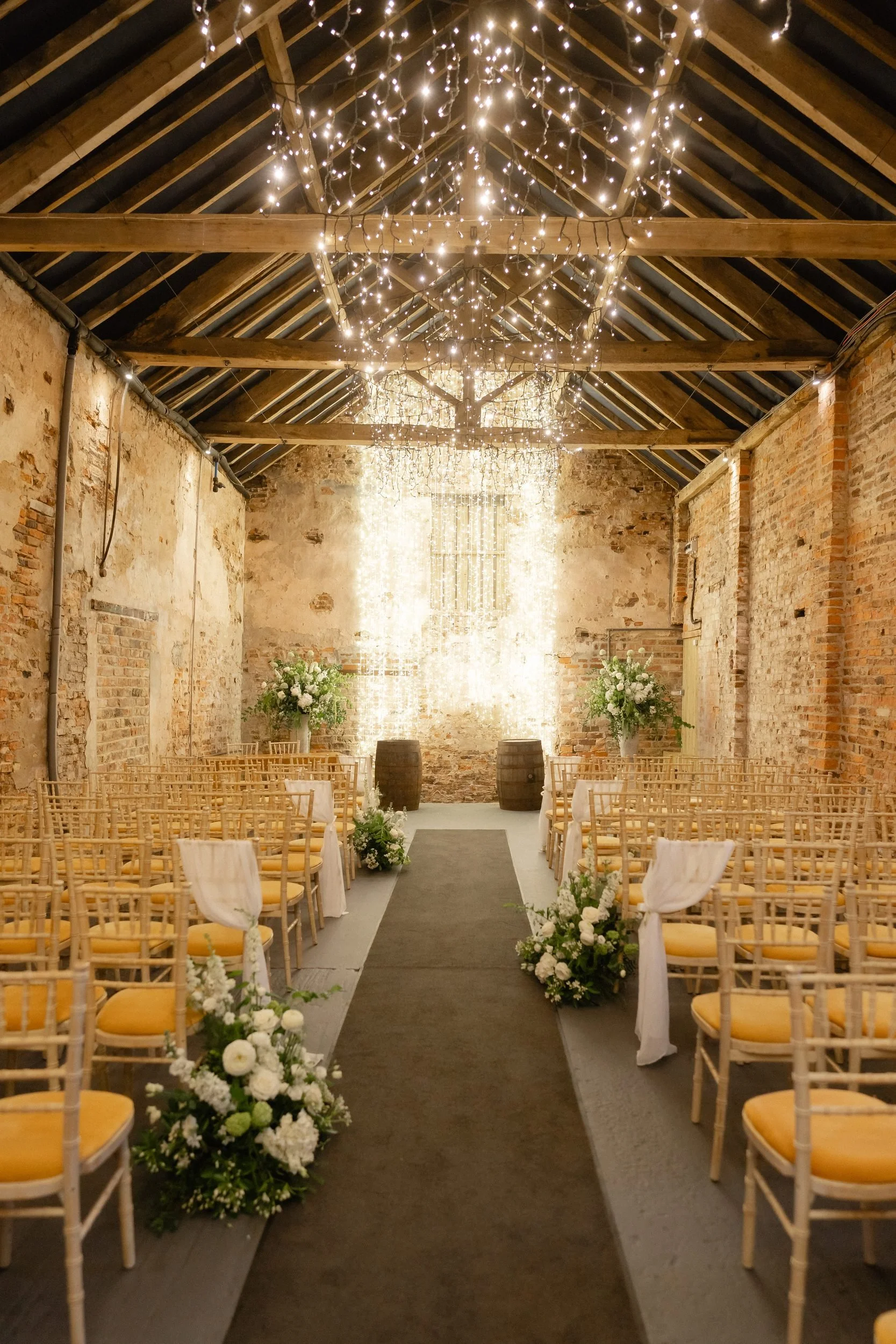 ceremony-barn-fairy-lights-wildflower-aisle-the-normans-13.jpg