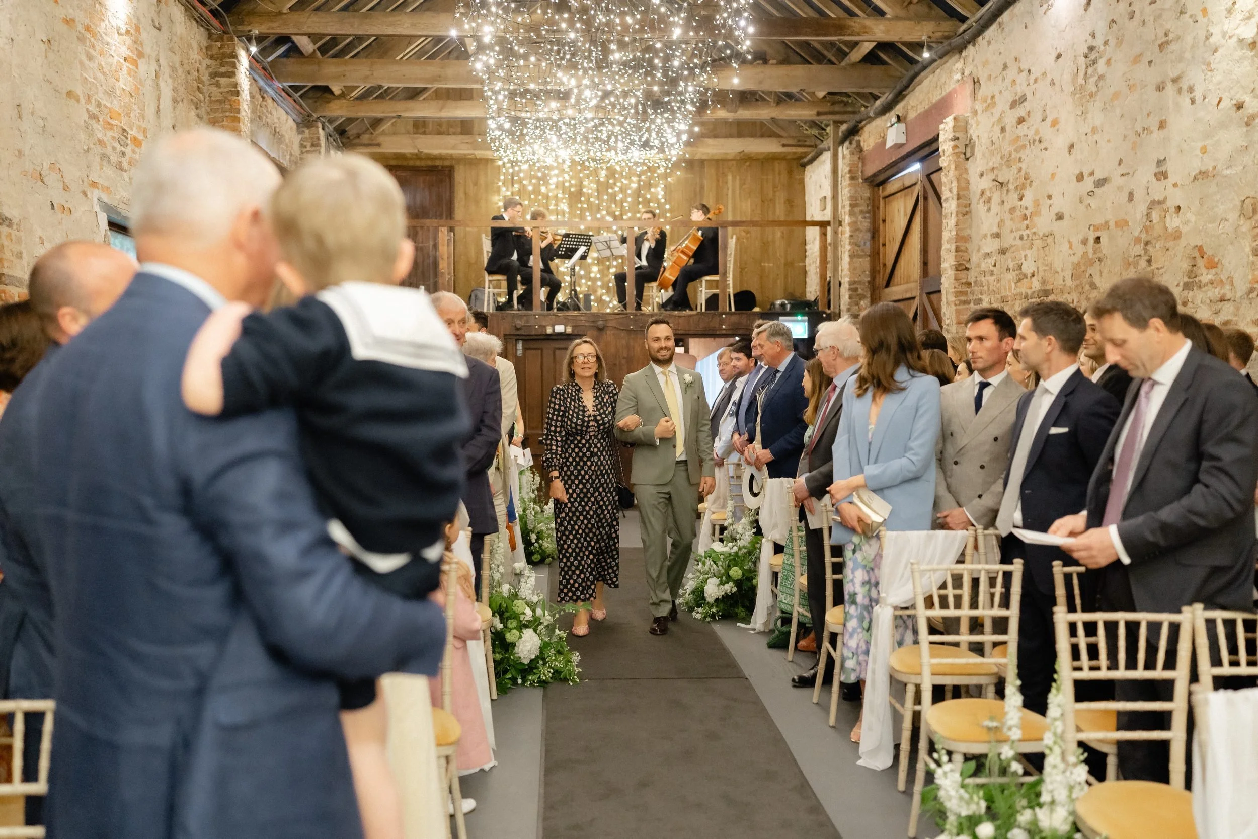ceremony-barn-guests-seated-string-quartet-balcony-242.jpg
