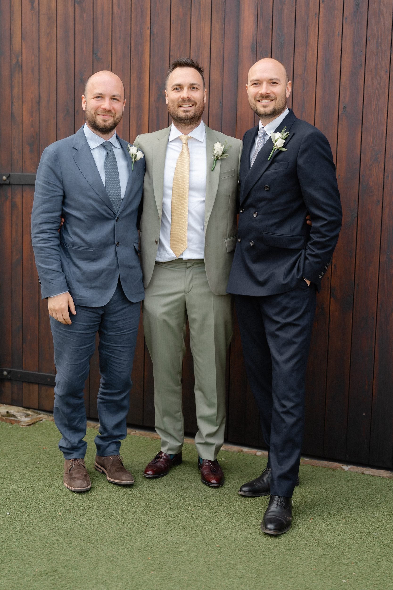 groom-and-groomsmen-barn-doors-sage-navy-suits-67.jpg