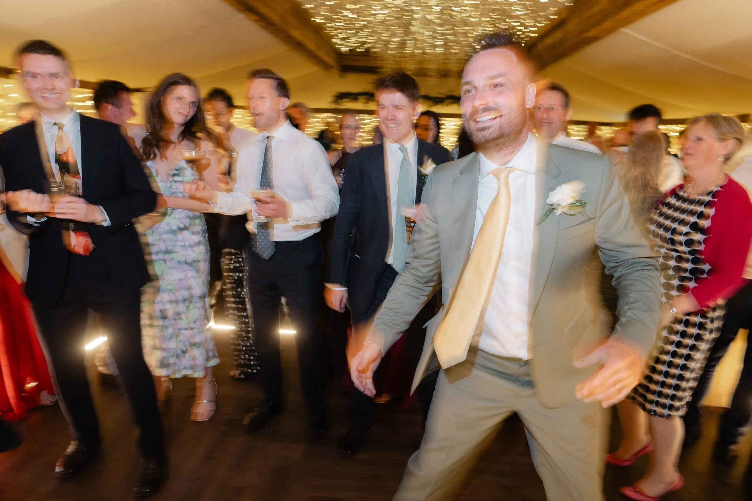 groom-dancing-guests-evening-reception-barn-864.jpg