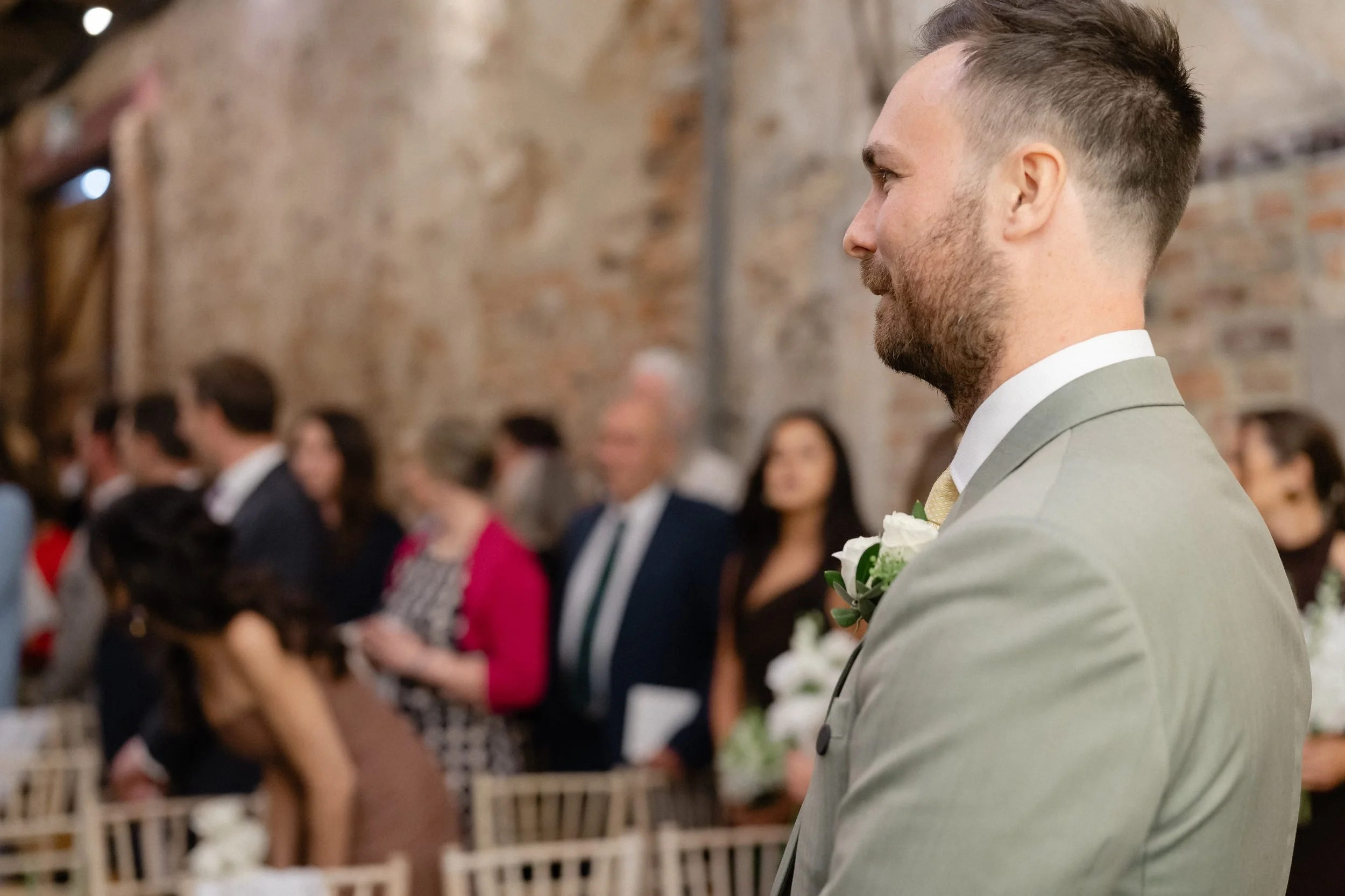 groom-waiting-at-altar-sage-suit-barn-ceremony-276.jpg