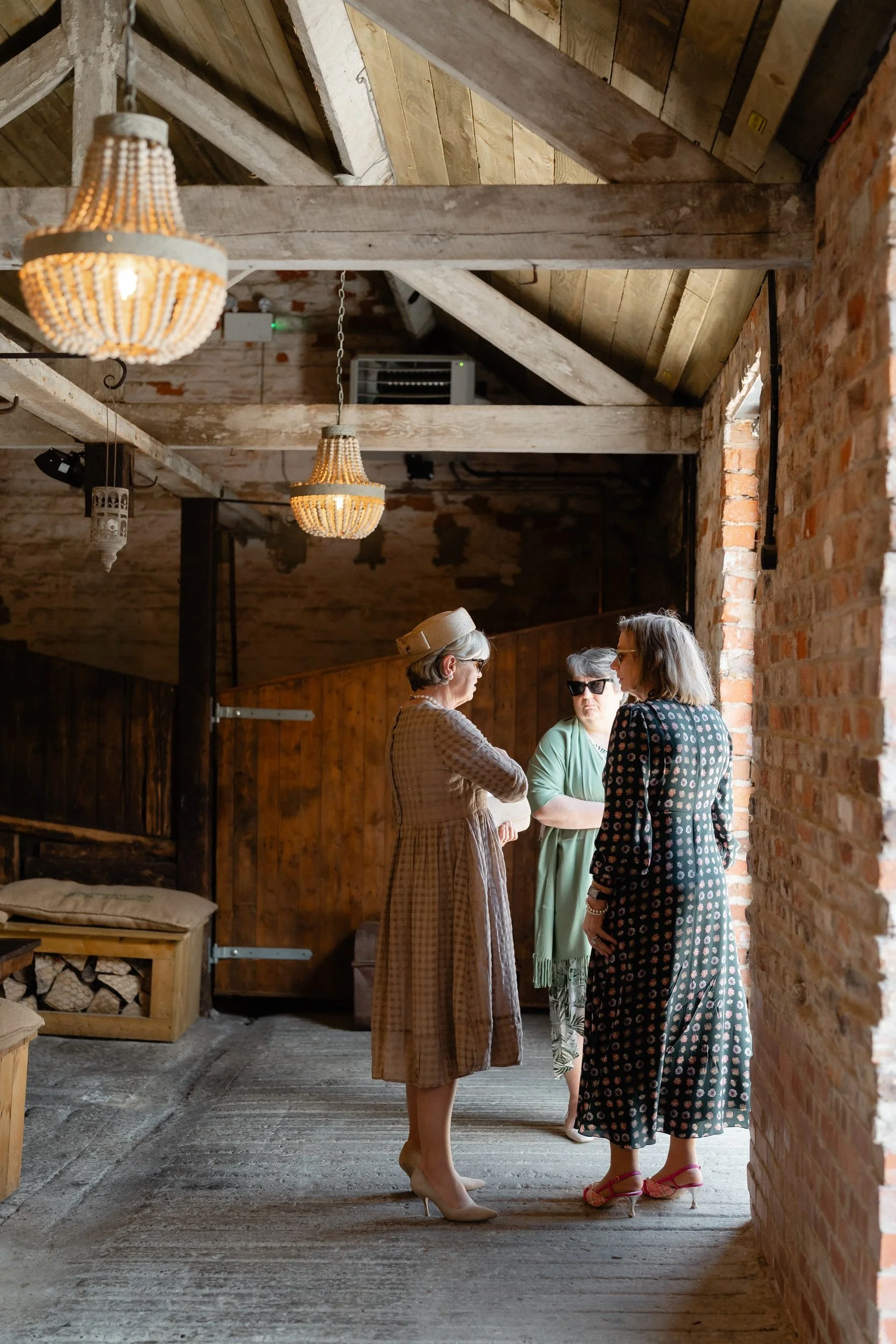 guests-arriving-rustic-barn-walkway-chandelier-184.jpg