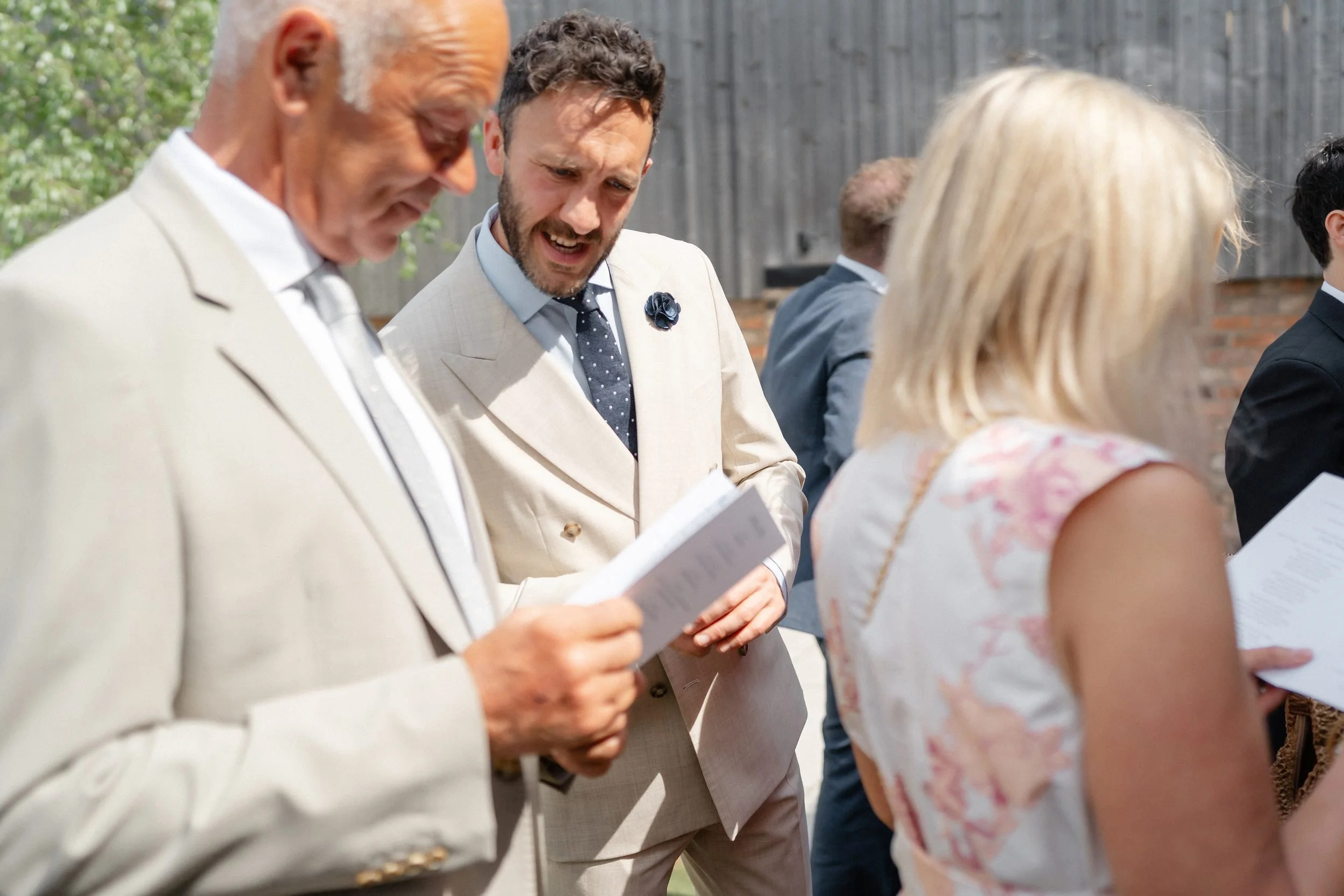 guests-reading-order-of-service-courtyard-210.jpg