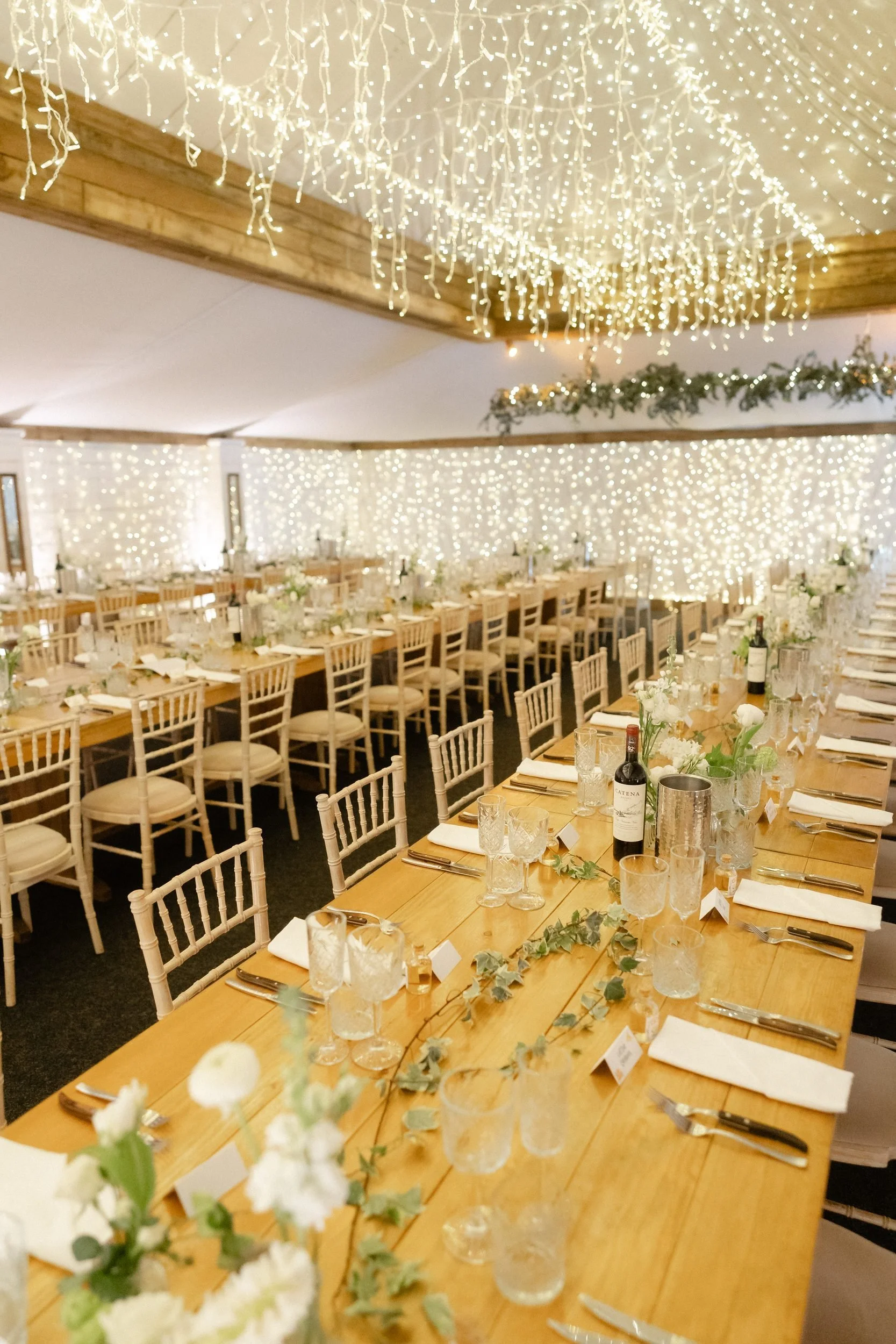 long-banquet-tables-fairy-lights-barn-wedding-reception-664.jpg