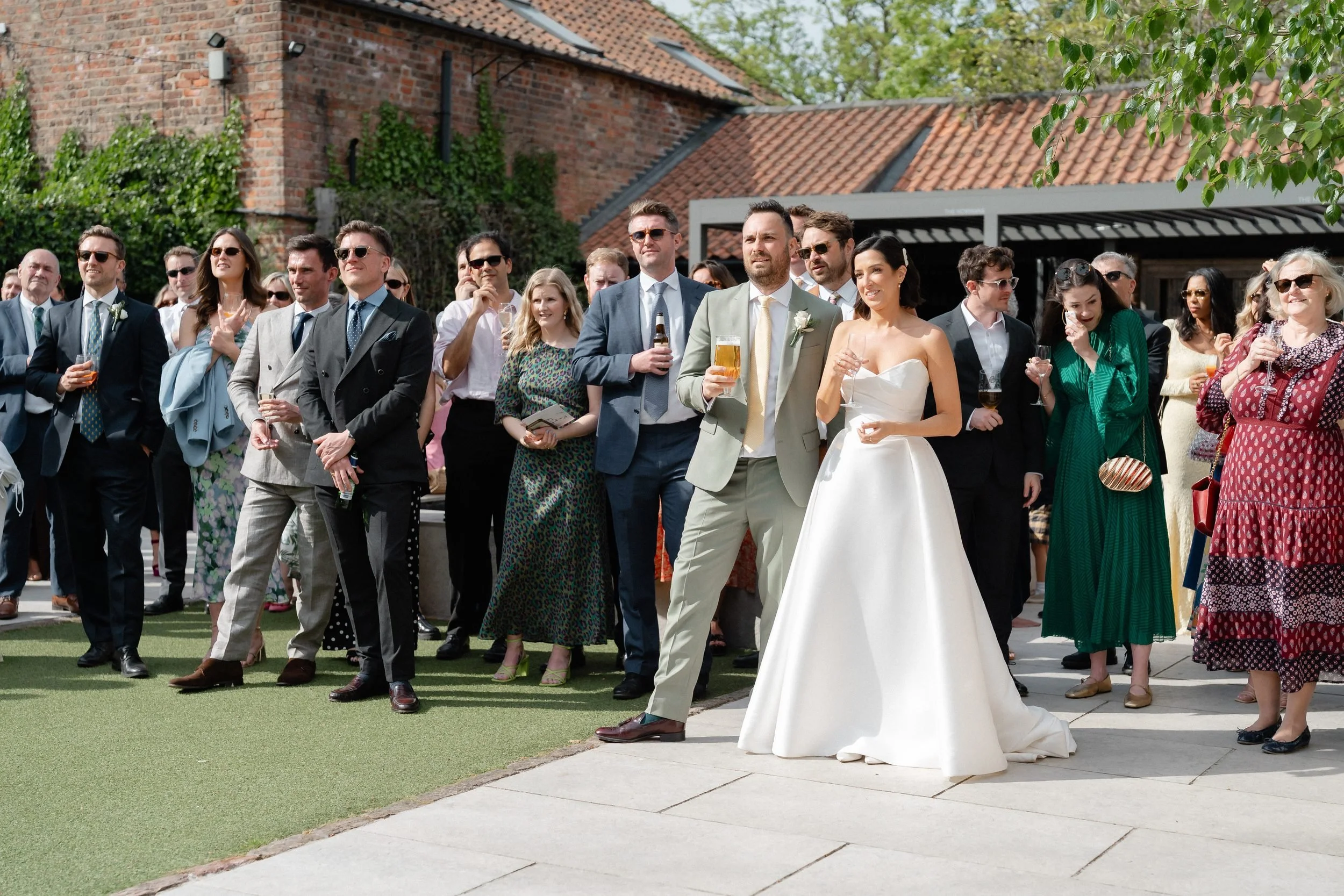 outdoor-wedding-speeches-guests-courtyard-the-normans-710.jpg