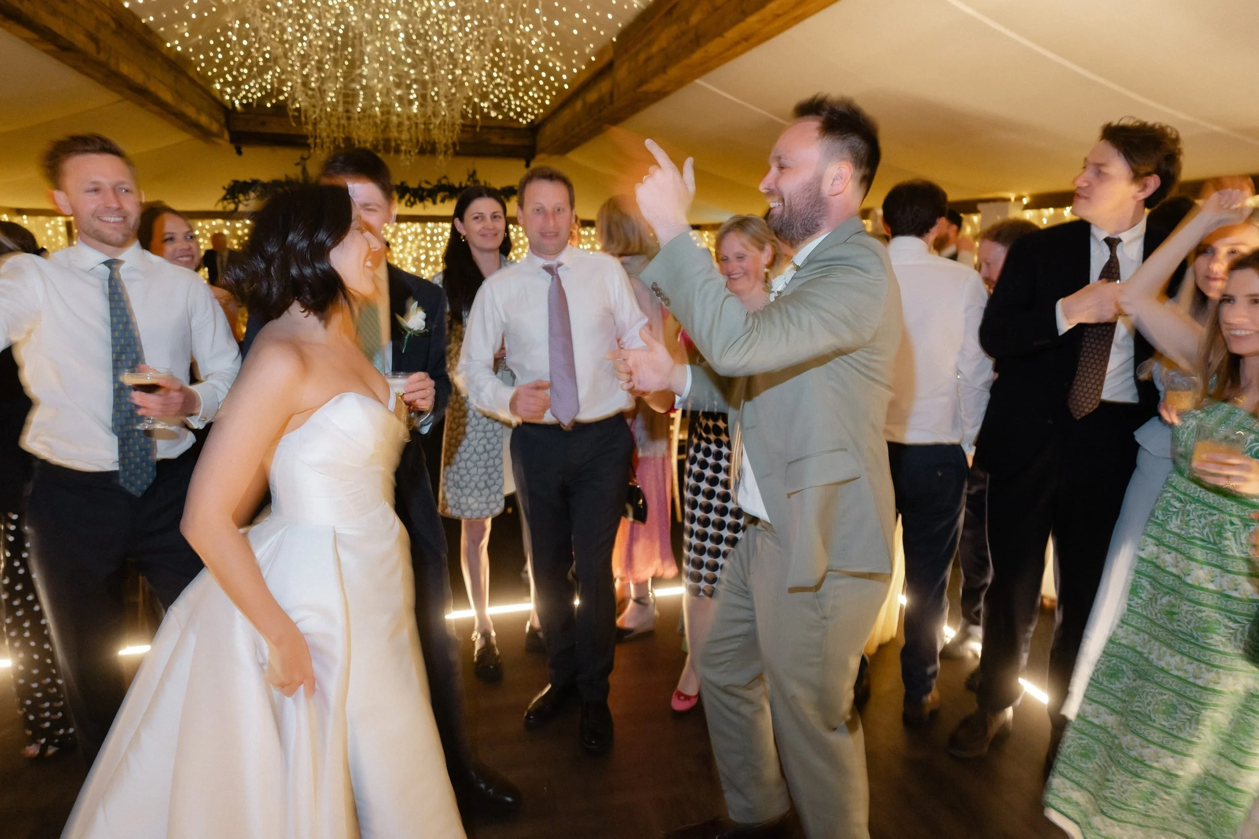 packed-dance-floor-barn-wedding-fairy-lights-865.jpg