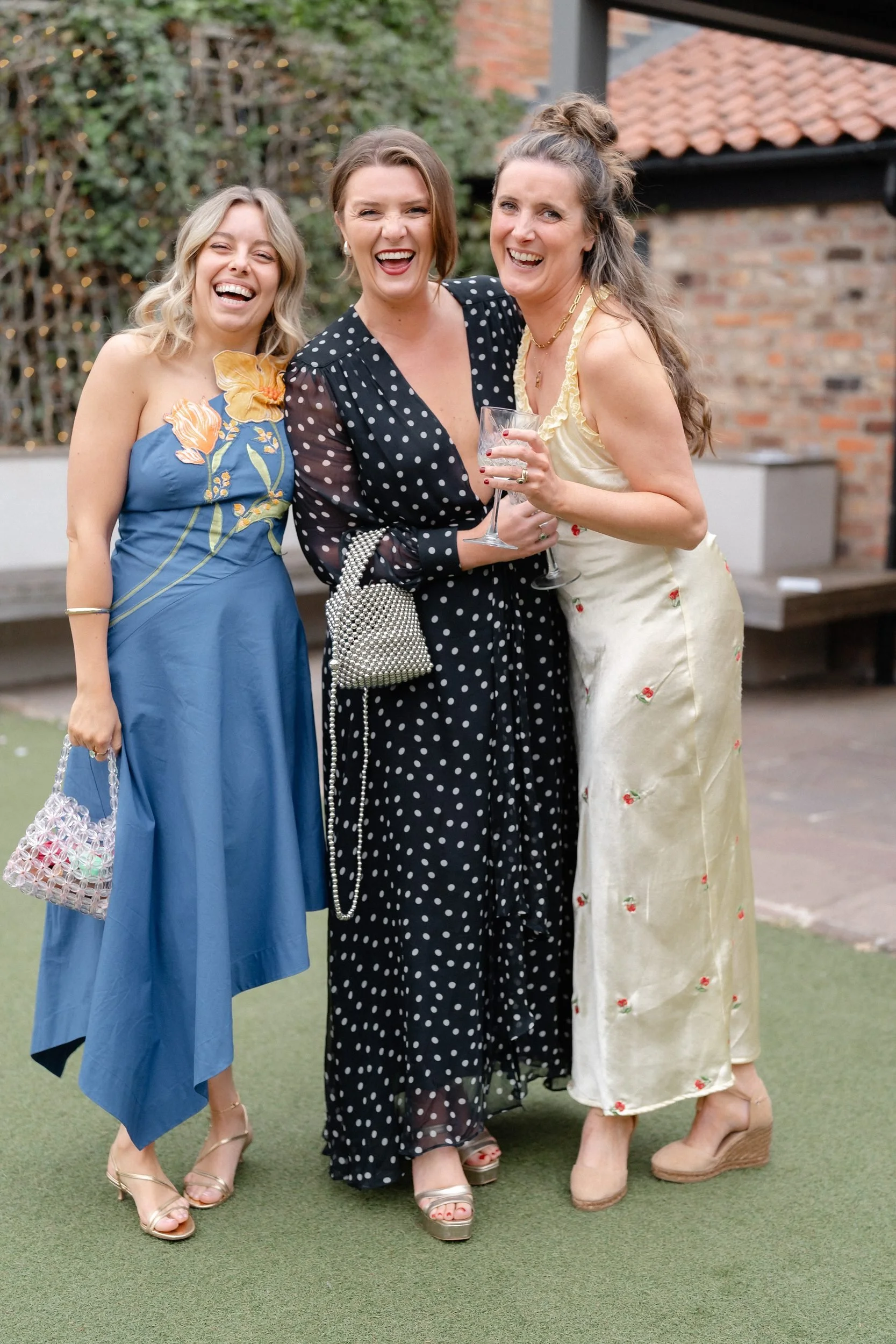 three-guests-laughing-evening-courtyard-822.jpg